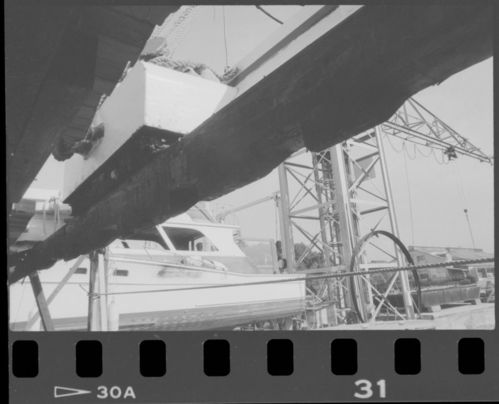Various views of Alma (built 1891; scow schooner) in drydock, 1987