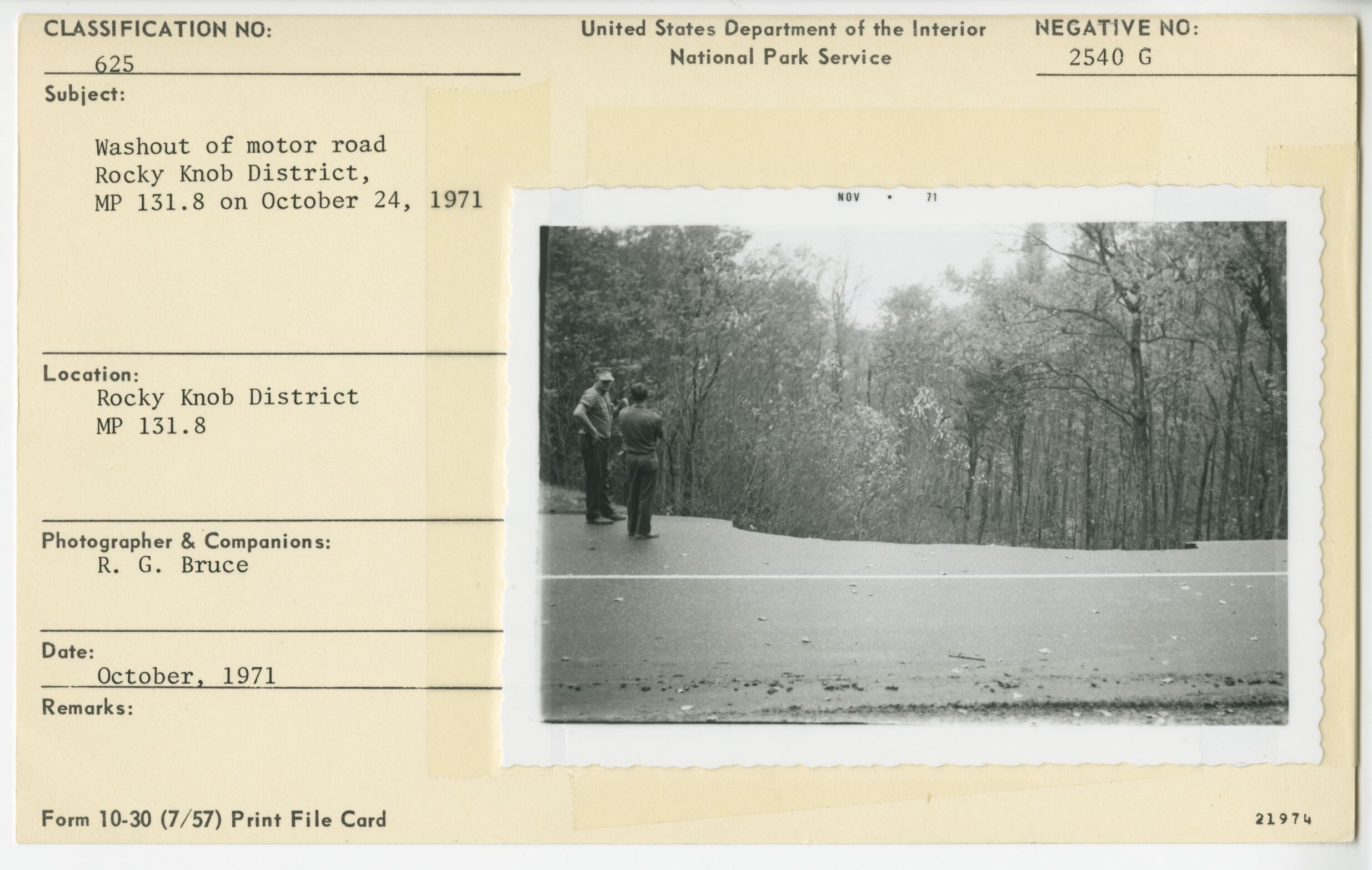People standing by washout of Parkway