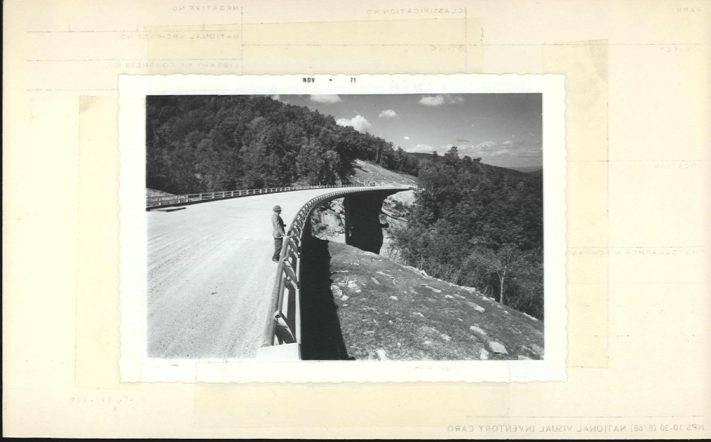 Man standing on Green Mountain Bridge