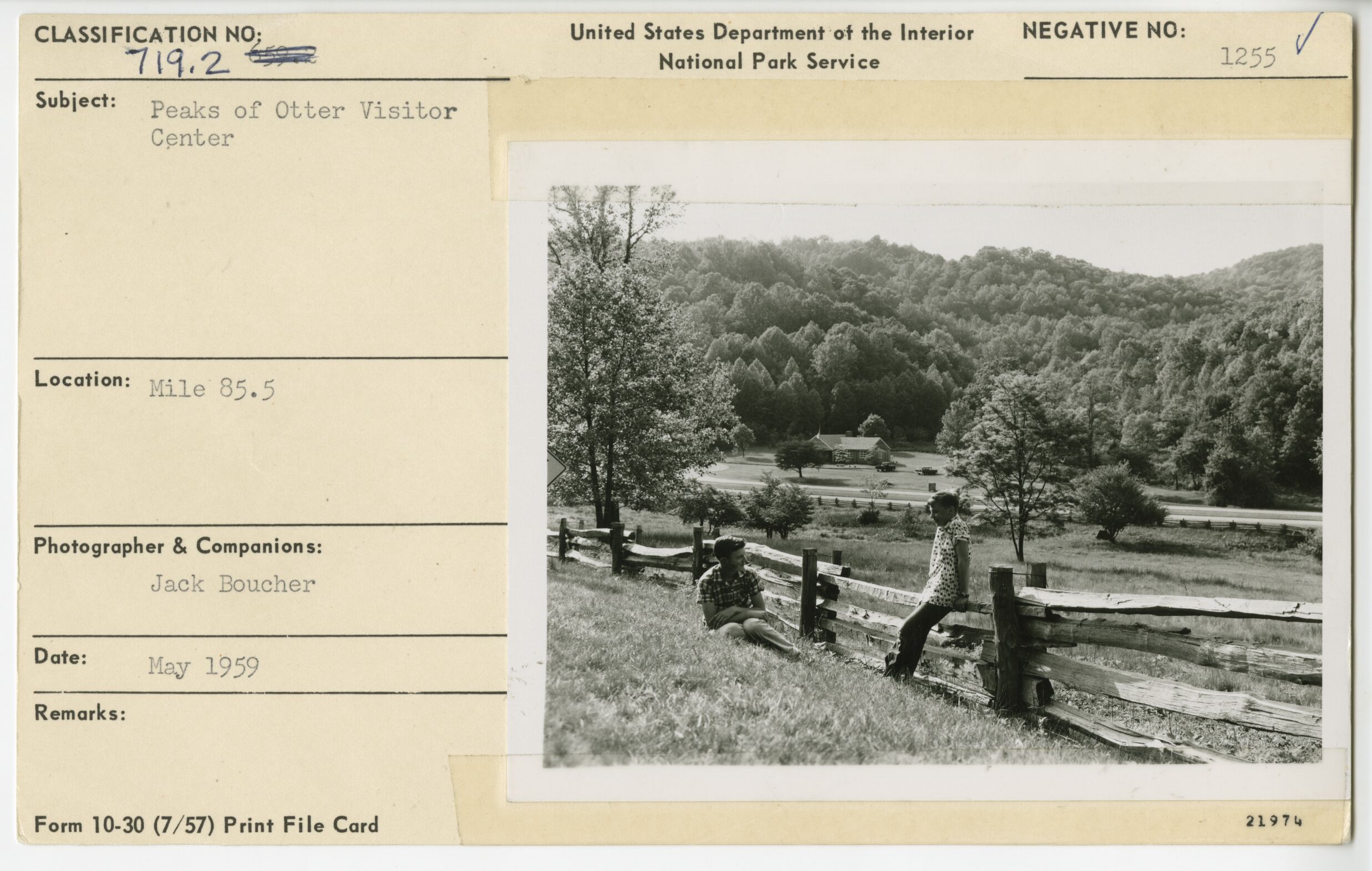 Visitors on fence near Peaks of Otter Visitor Center