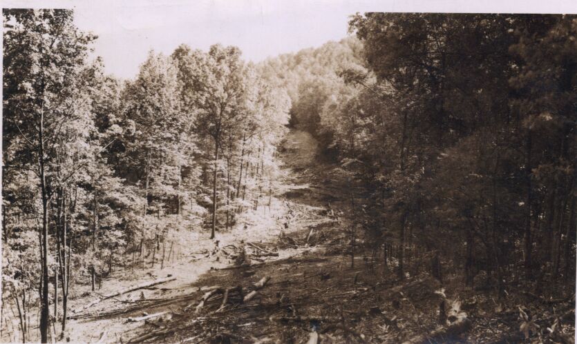 Looking ahead of cleared right of way showing Pioneer Road in distance at Station 282+50
