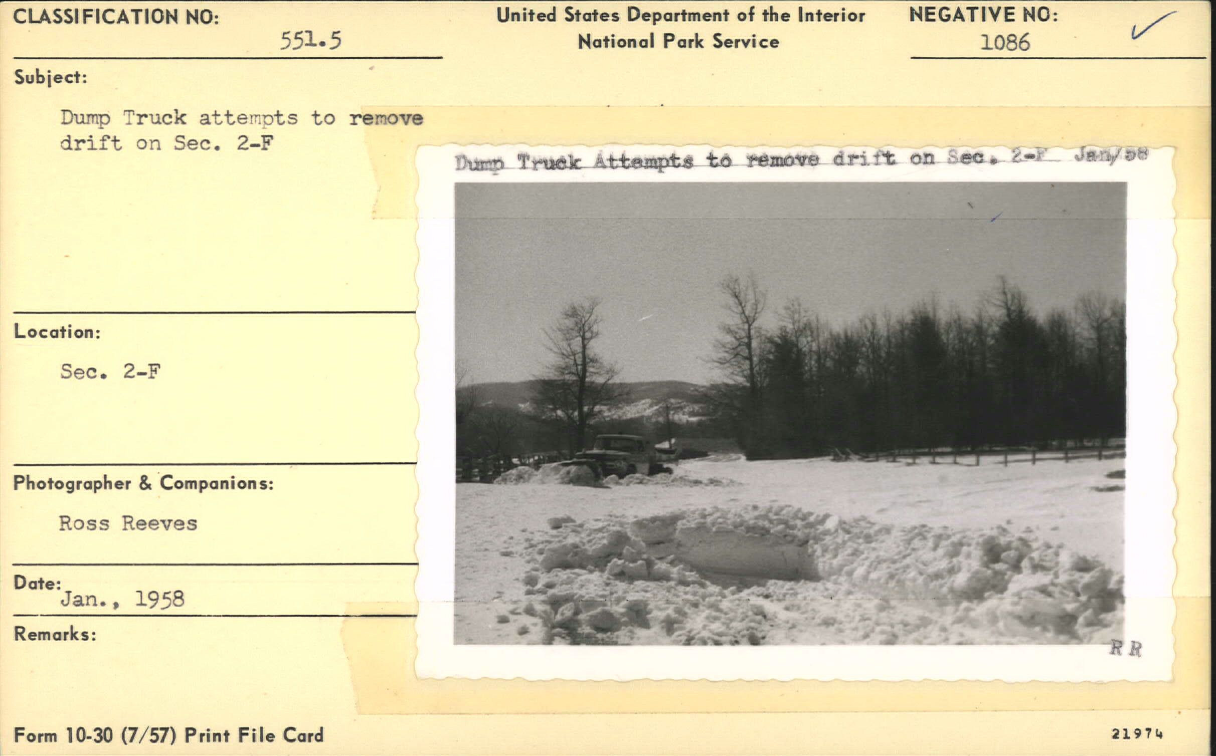 Dump truck attempts to remove snow drift