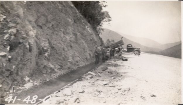 Pouring bituminous gutter, Station 111+00