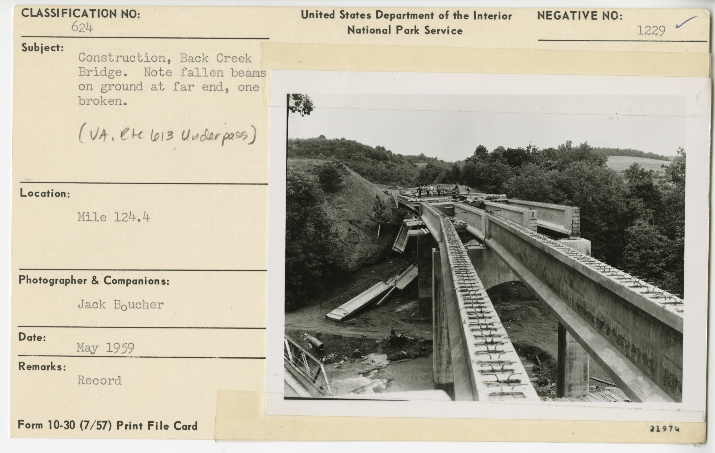Construction of Back Creek Bridge showing fallen beams on ground