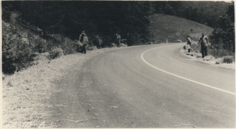 Spreading straw mulch at Station 182