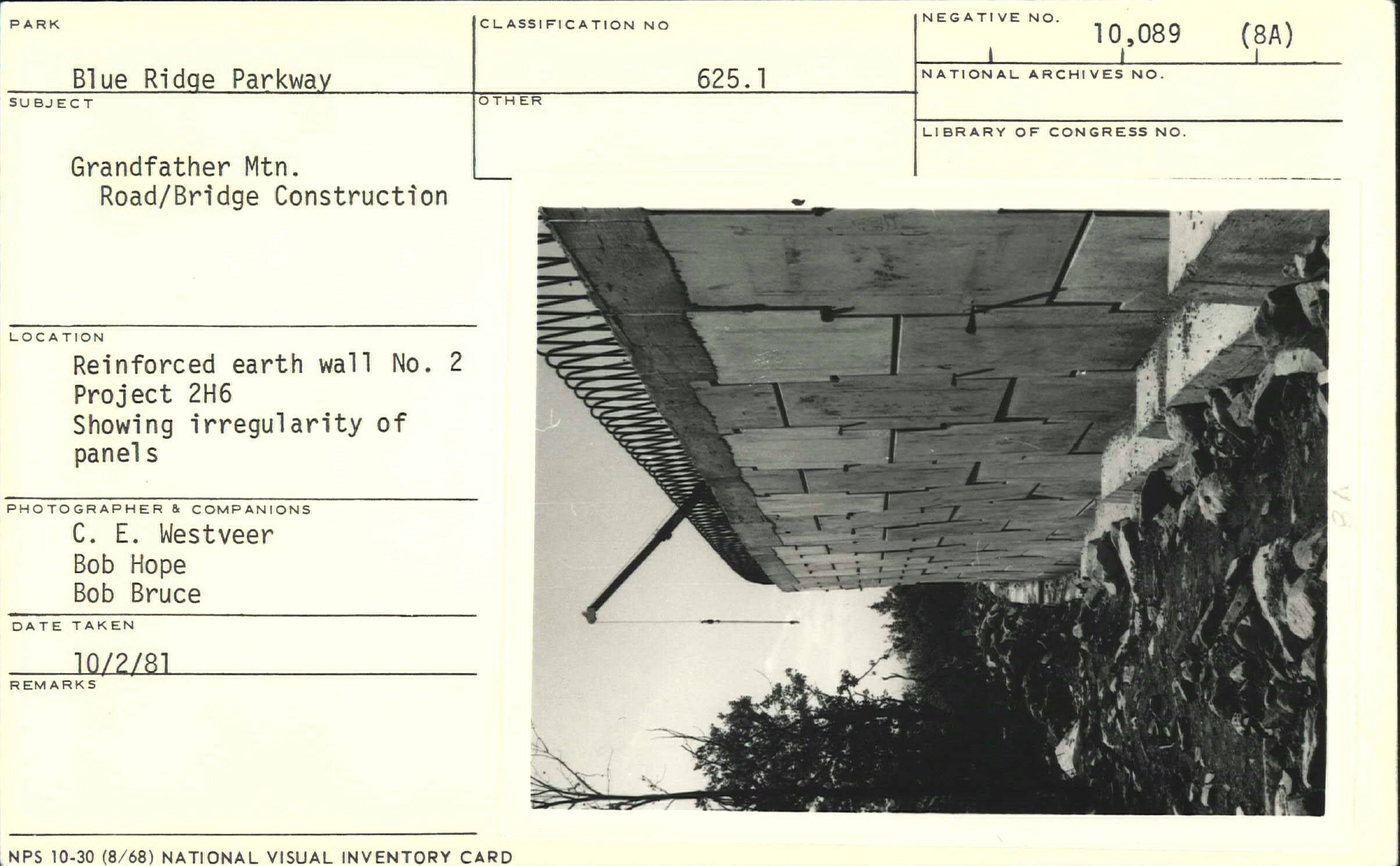Construction showing masonry faced reinforced earth wall and irregularity of panels