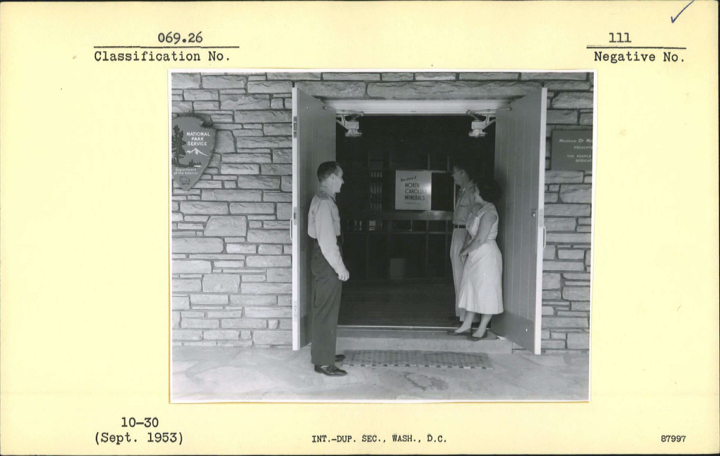 Mr. Banks Curtis and visitors at Museum entrance