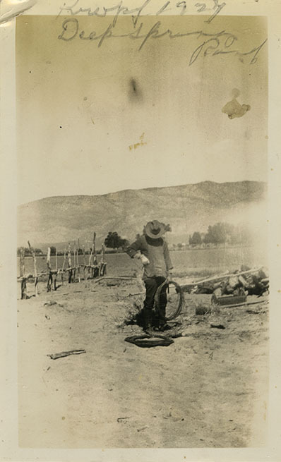 This is an historic black and white photograph from the Scotty's Castle Historic Photograph Collection, Death Valley National Park of Frederick William Kropf working at Deep Springs Ranch, 1927.