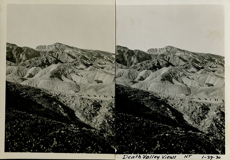 This is an historic black and white photograph from the Scotty's Castle Historic Photograph Collection, Death Valley National Park of Death Valley scene with rock formations and mountains. January 29, 1930. Photographed by Mat Roy Thompson.