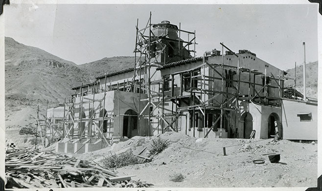 This is an historic black and white photograph from the Scotty's Castle Historic Photograph Collection, Death Valley National Park of Scotty's Castle Main House, looking northwest. Little progress in construction on this area of Main House since July 31 photograph. October 2, 1927. Photographed by Mat Roy Thompson.