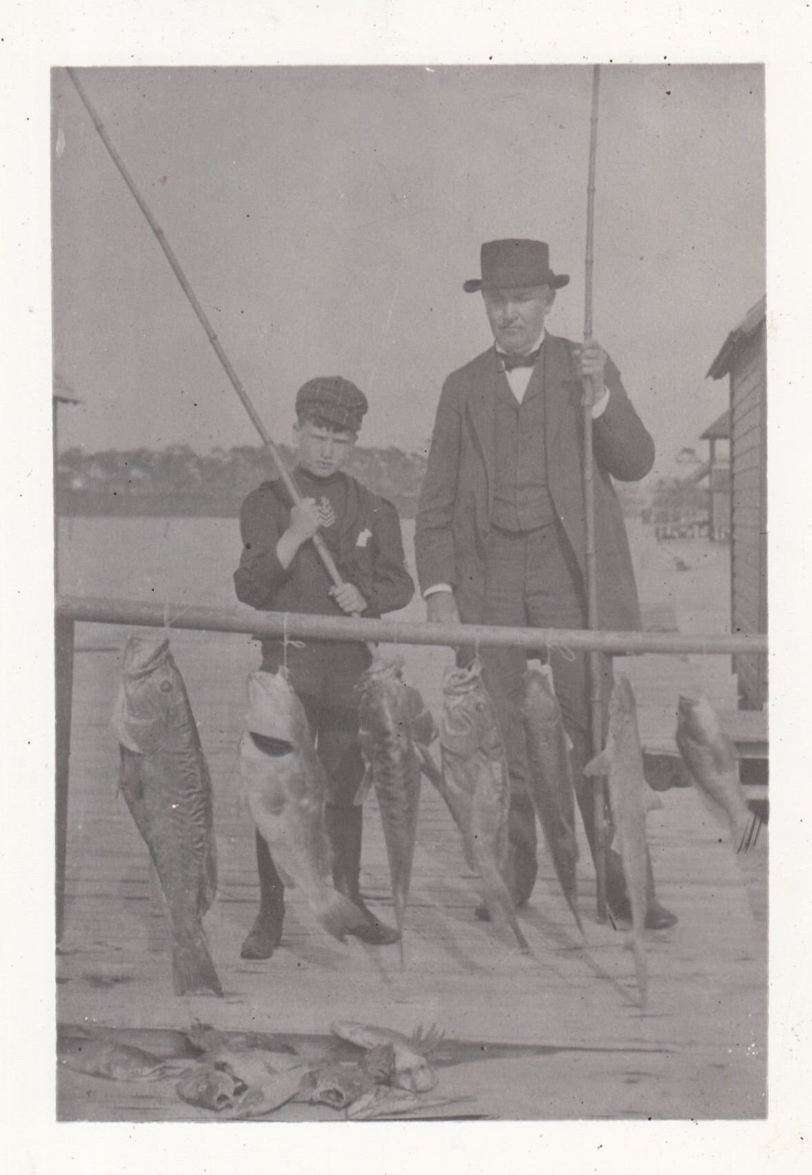 Thomas Edison and Charles Edison fishing. Charles is about 10 years old.