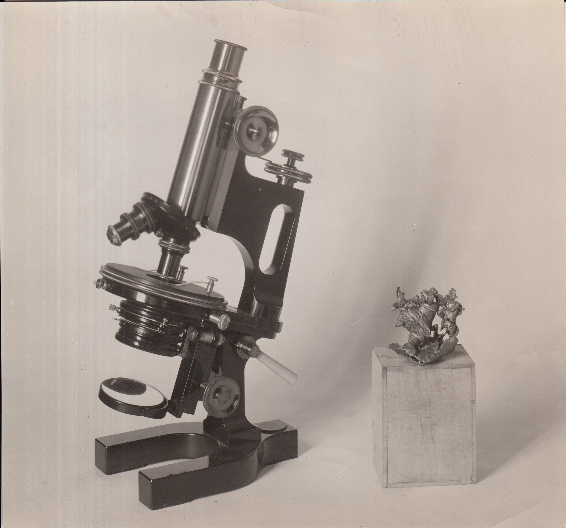 Microscope mechanism after the fire, compared with intact microscope.