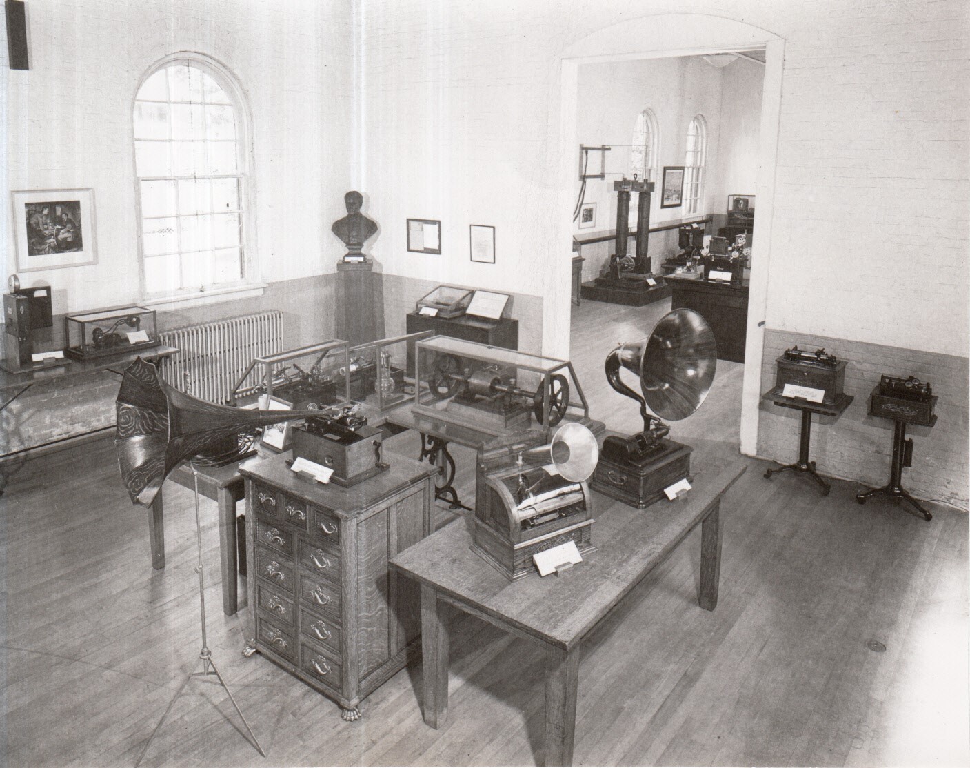 Artifacts on display in exhibition rooms in Building 1, including phonographs and dynamo.