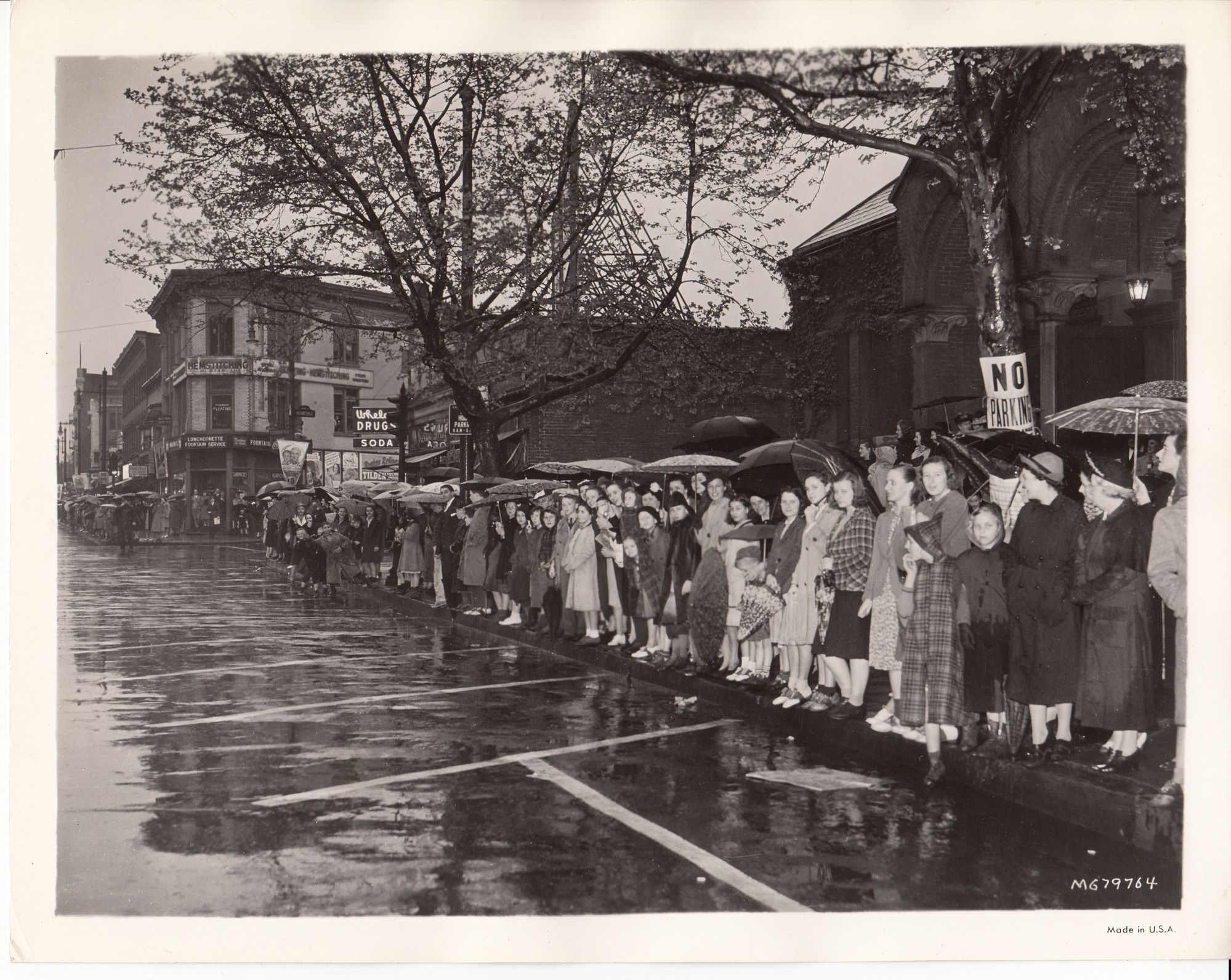 Crowds lining the streets on Central Ave. in East Orange, New Jersey for parade at premiere of "Edison, the Man."