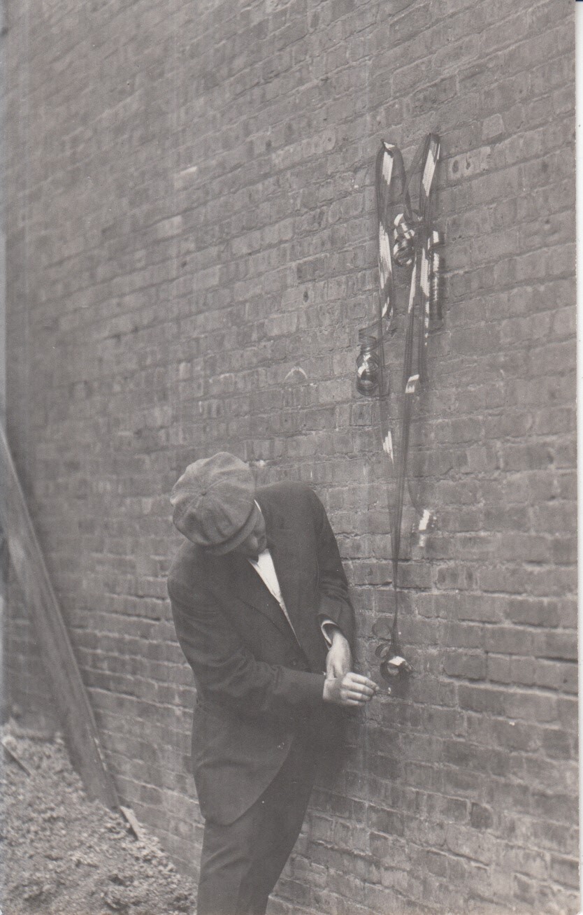 Miller Reese Hutchison about to ignite film used in the Edison home projecting kinetoscope to test its flammability.