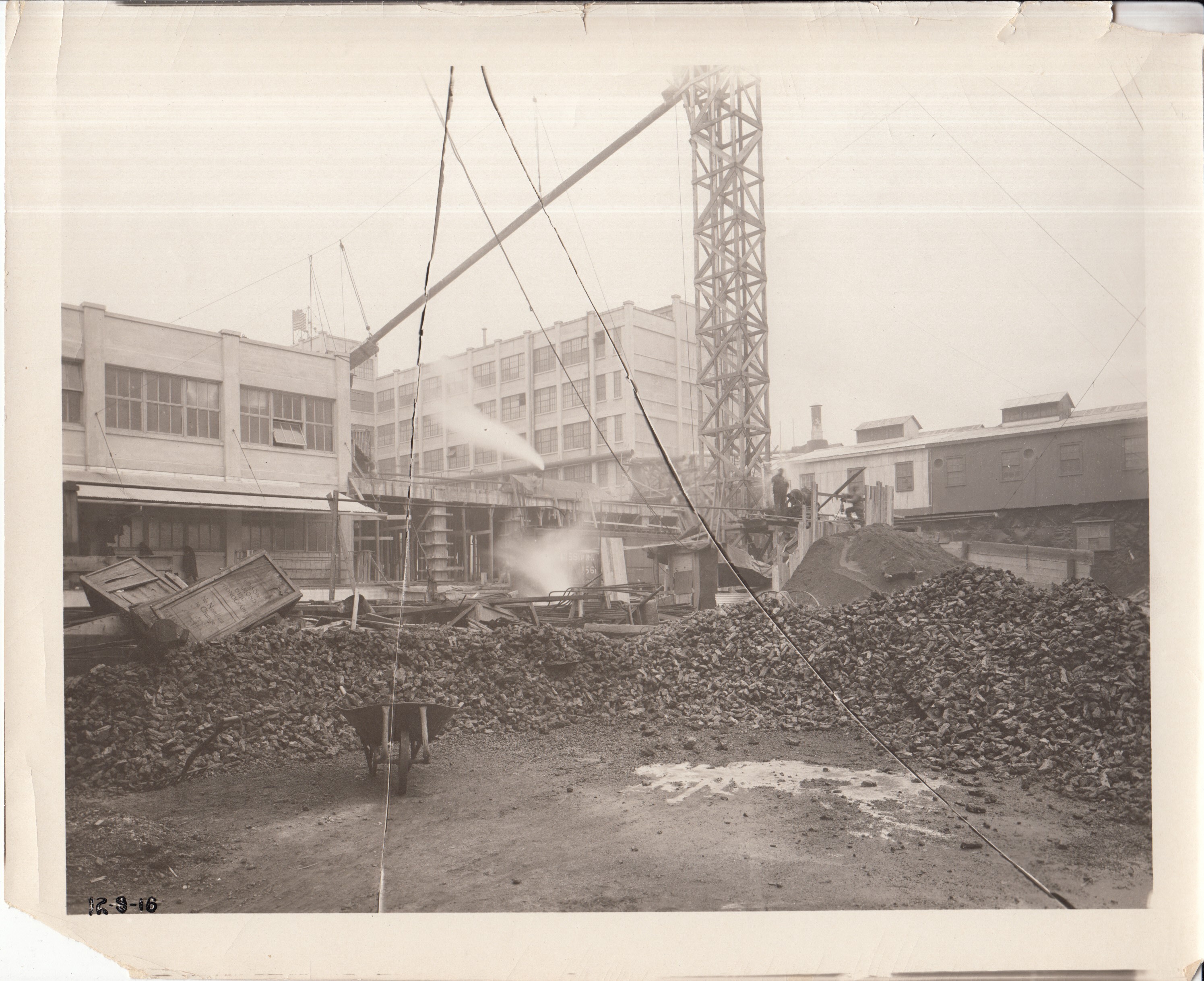 Construction of second half of Building 21 viewed from yard, first floor construction.