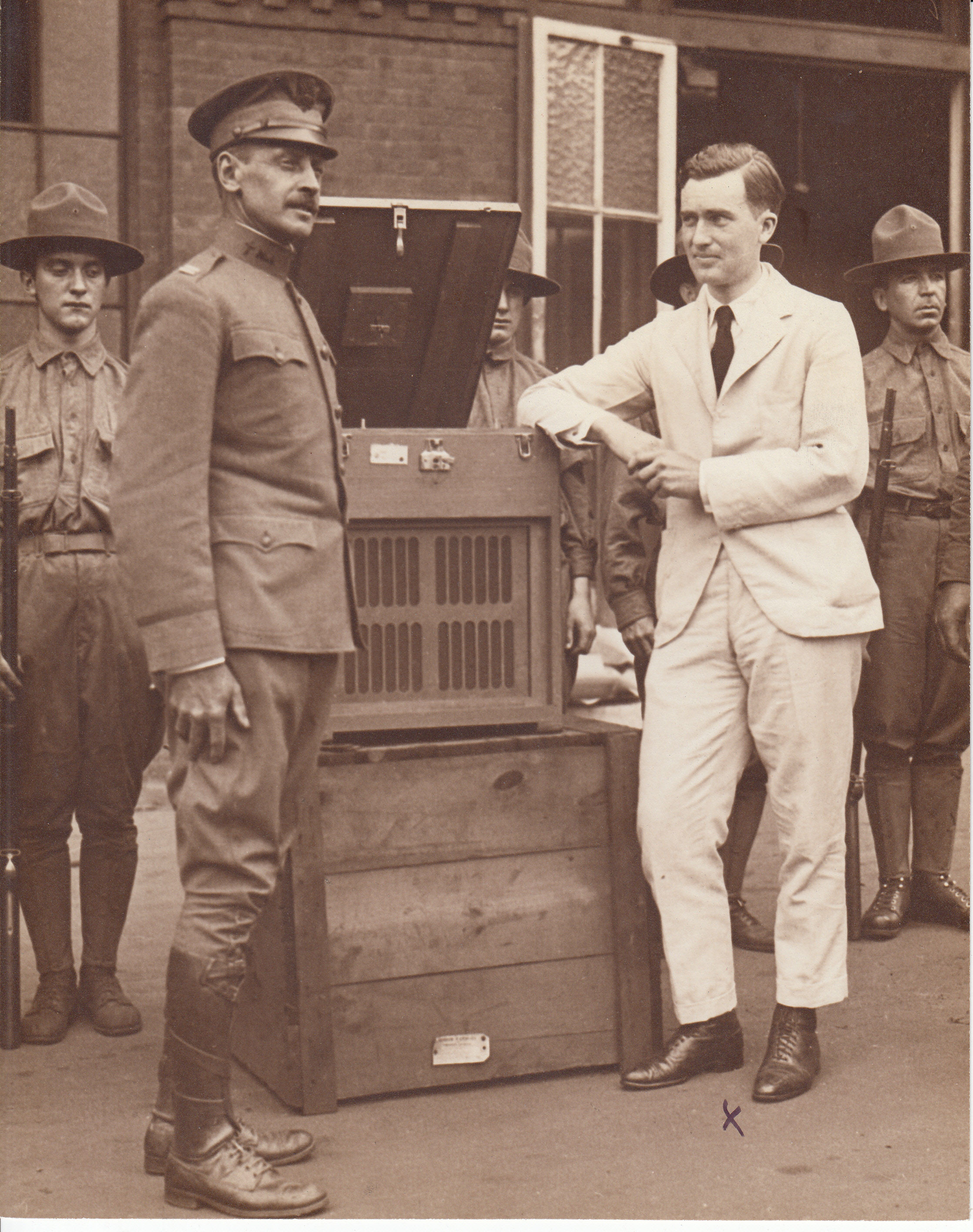 Charles Edison and soldiers with Phonograph (Army and Navy model) during World War I.