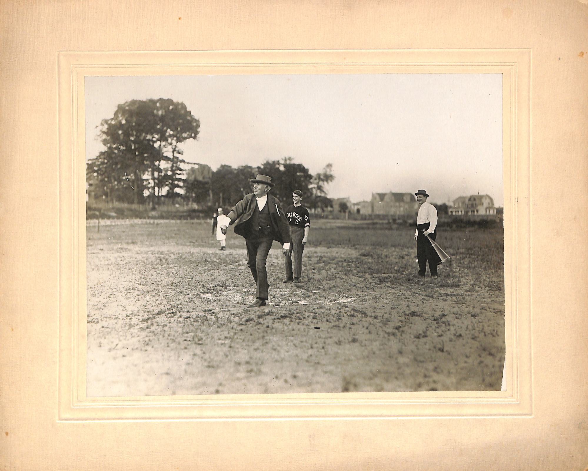 Thomas Edison throwing a pitch during a baseball game at Olympic Park during Edison Field Day.