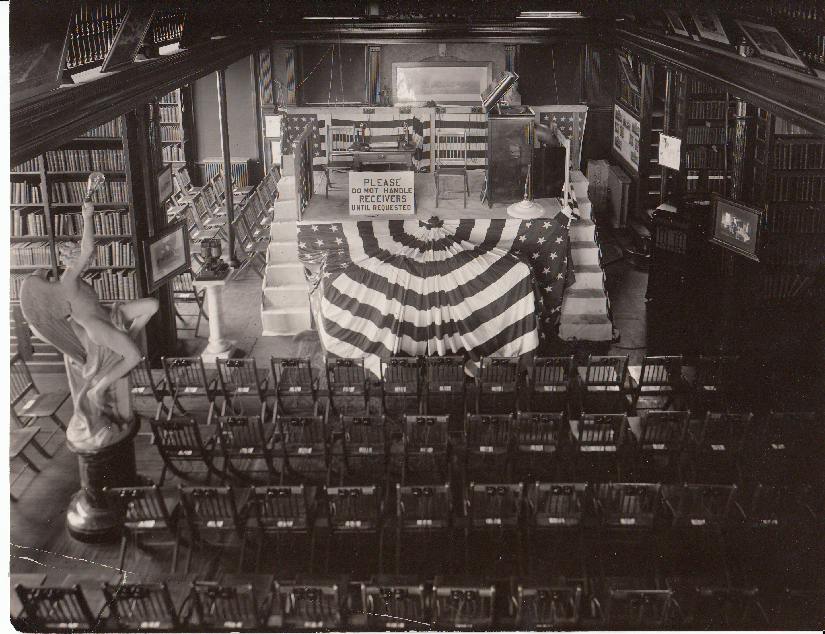 Edison Day, chairs equipped with telephone receivers, set up in library for transcontinental telephone conversation with Thomas Edison. Edison was speaking from the San Francisco Panama Pacific International Exposition.
