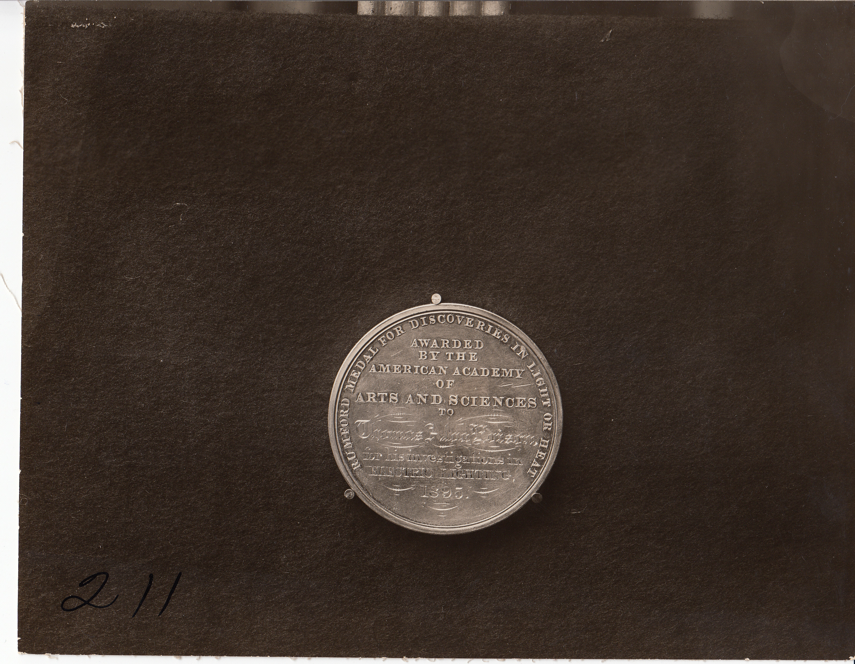 Benjamin Count Rumford medal (1895) for discoveries in light or heat, inscription side.
