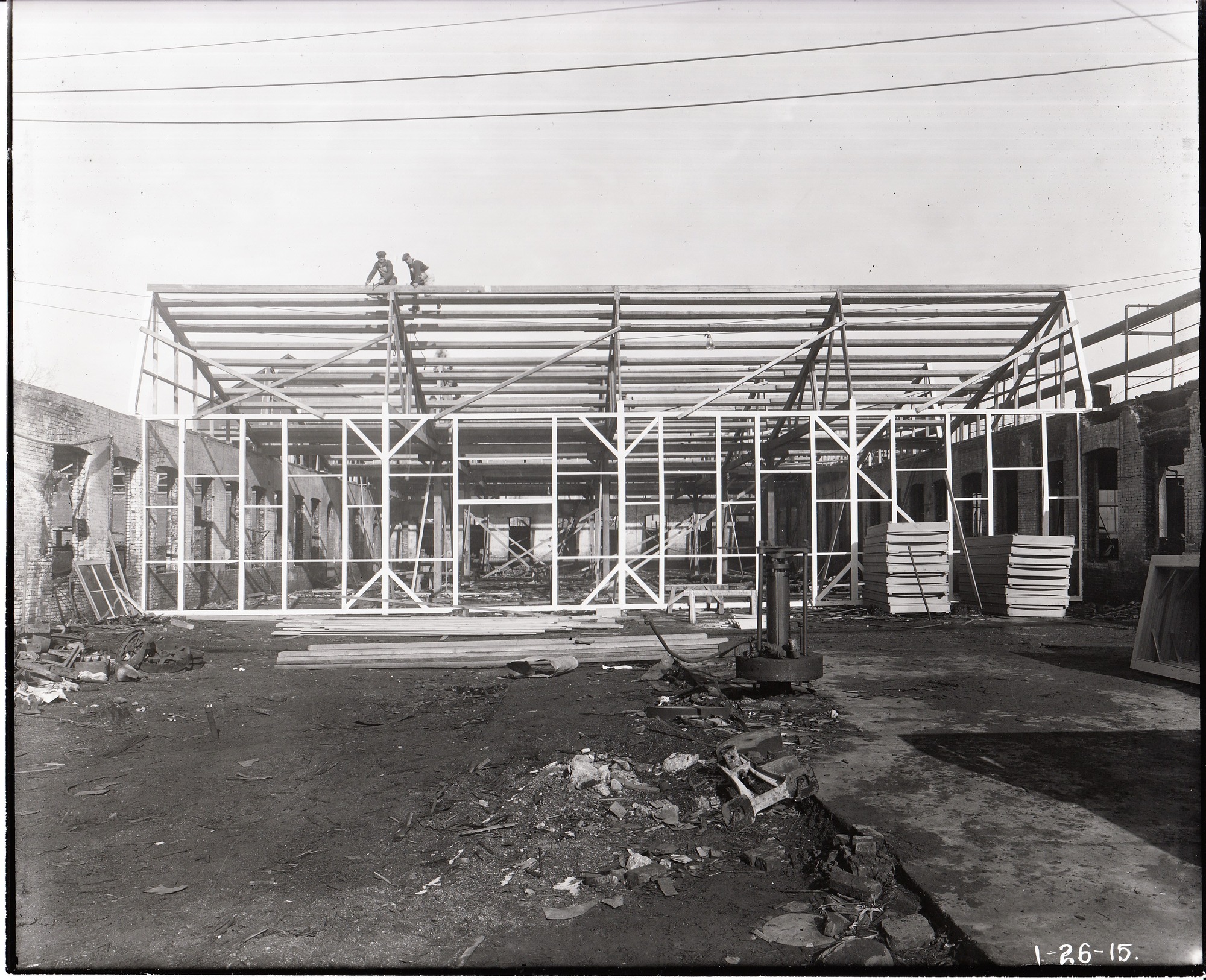 Reconstruction of cabinet shop no. 2, roof frames in place.