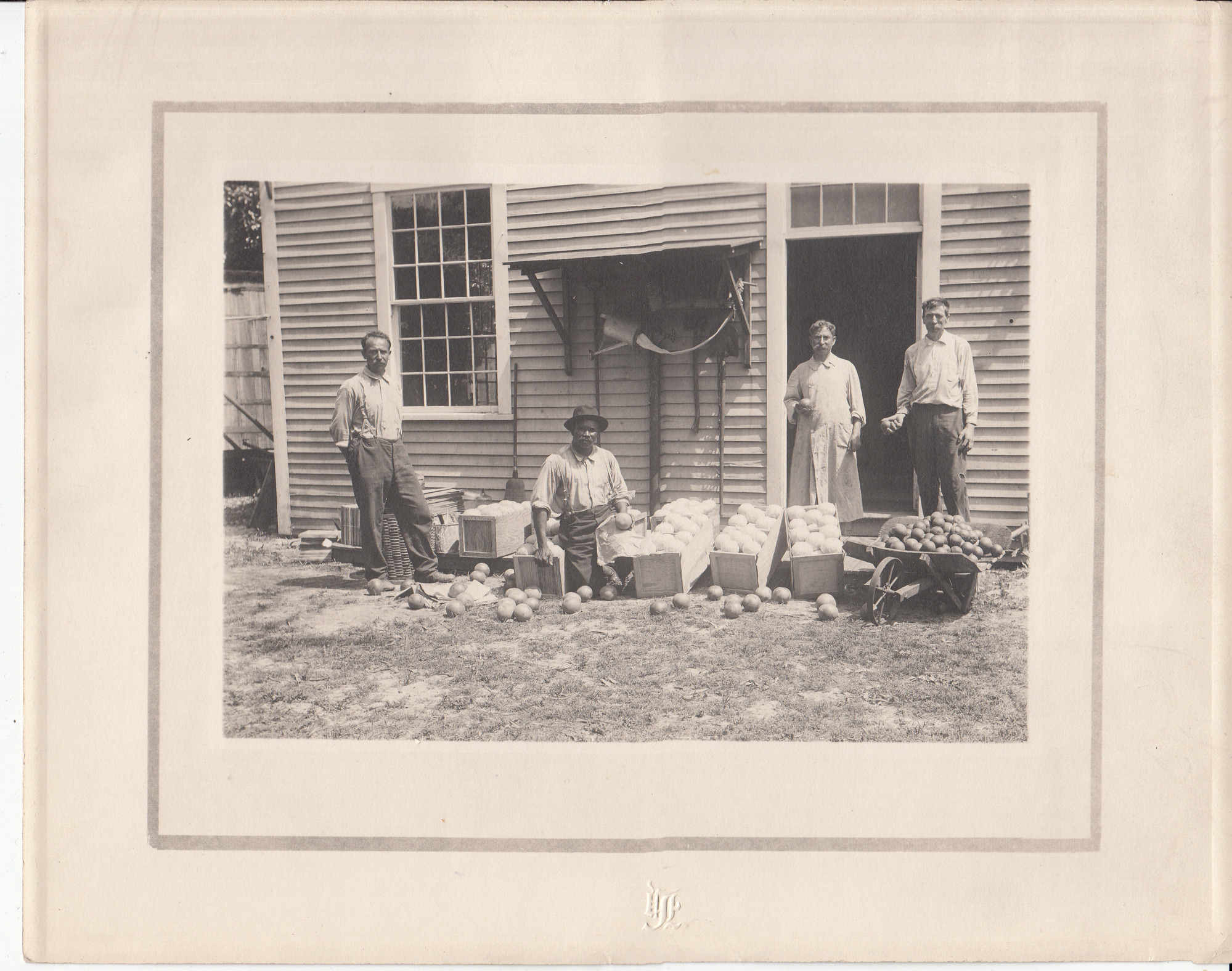 Fred Ott in doorway, and other workers outside Ft. Myers laboratory.