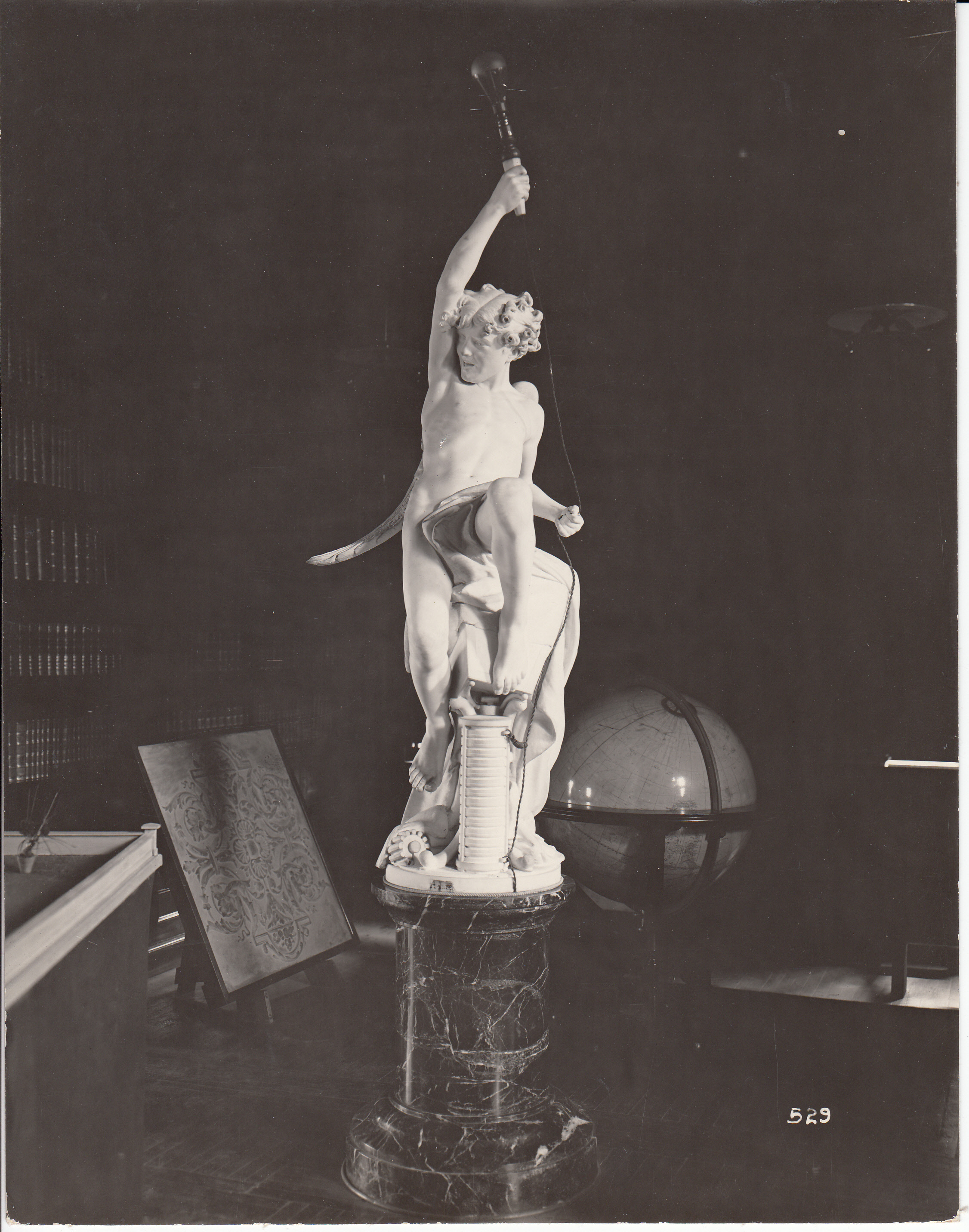 "Genius of Electricity," or "Genius of Light" figure holding aloft an incandescent lamp.