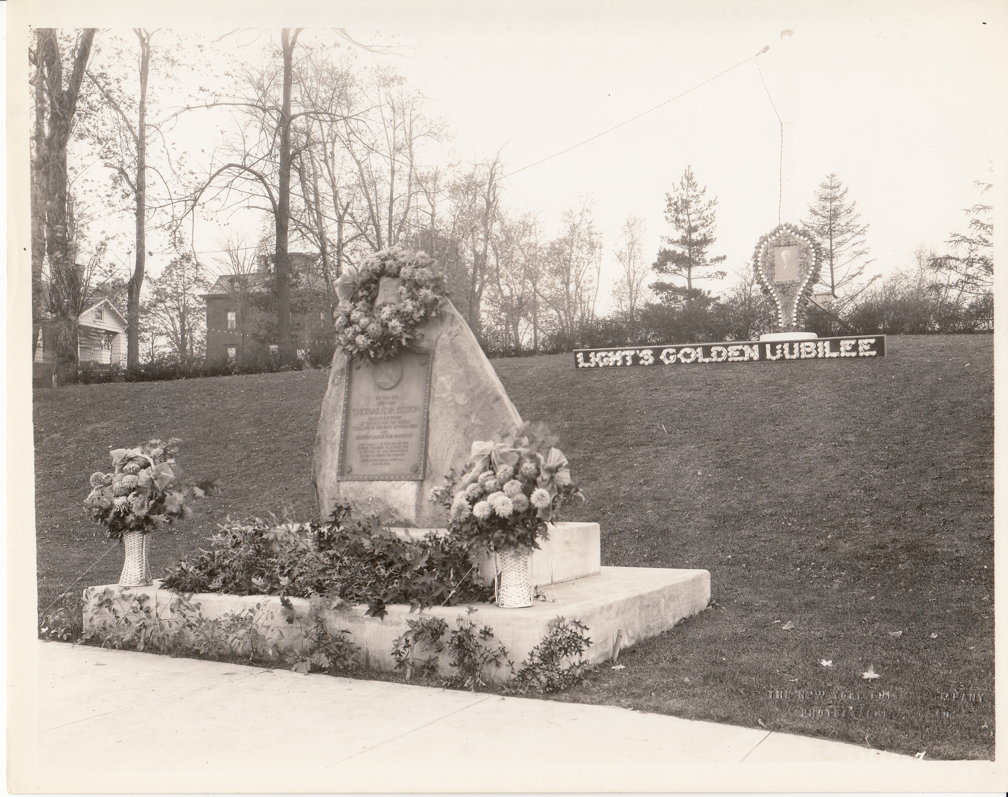 Sign and model of incandescent lamp behind Menlo Park memorial for Light's Golden Jubilee.