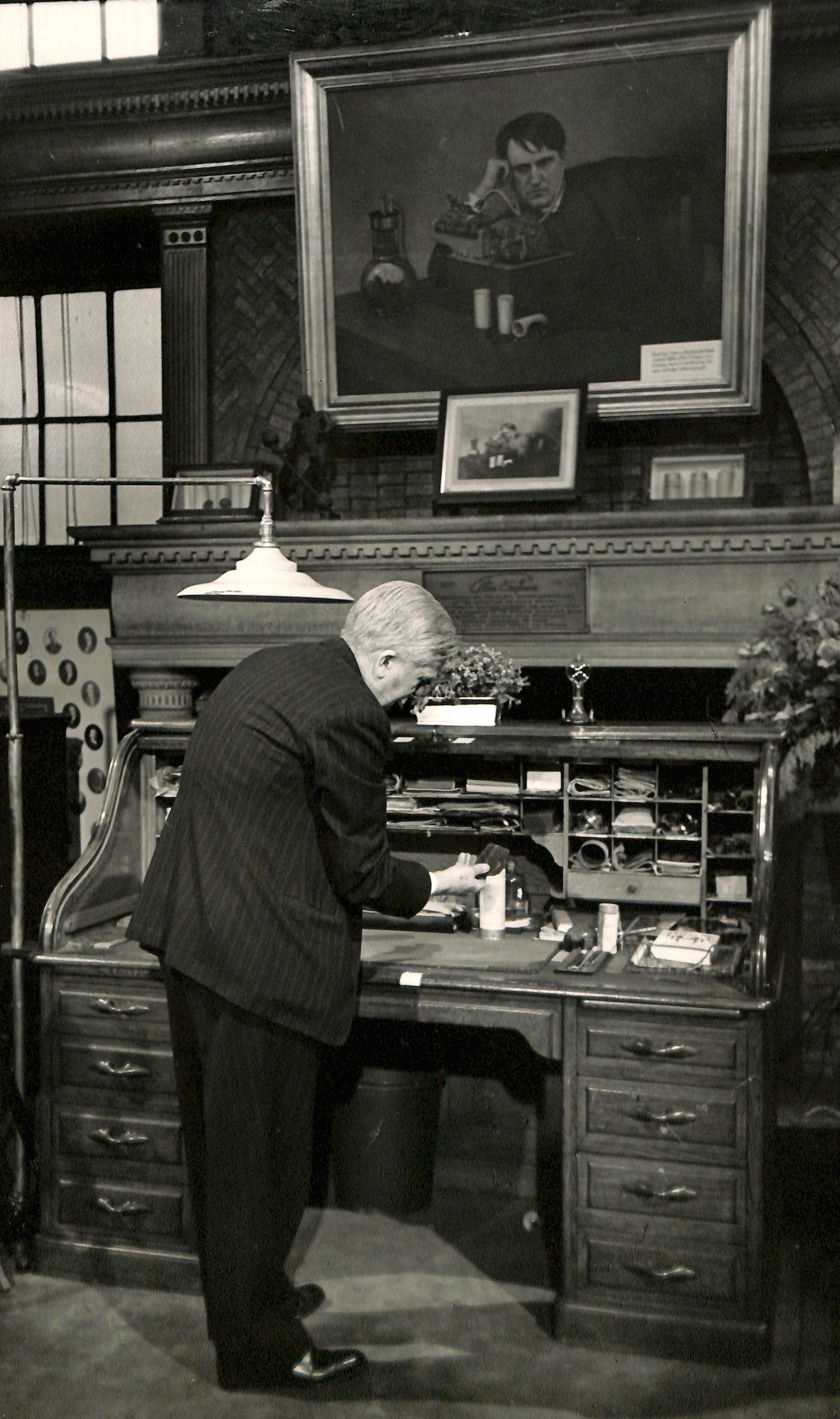 Charles Edison opening his father's desk in a ceremony in the library at the West Orange laboratory