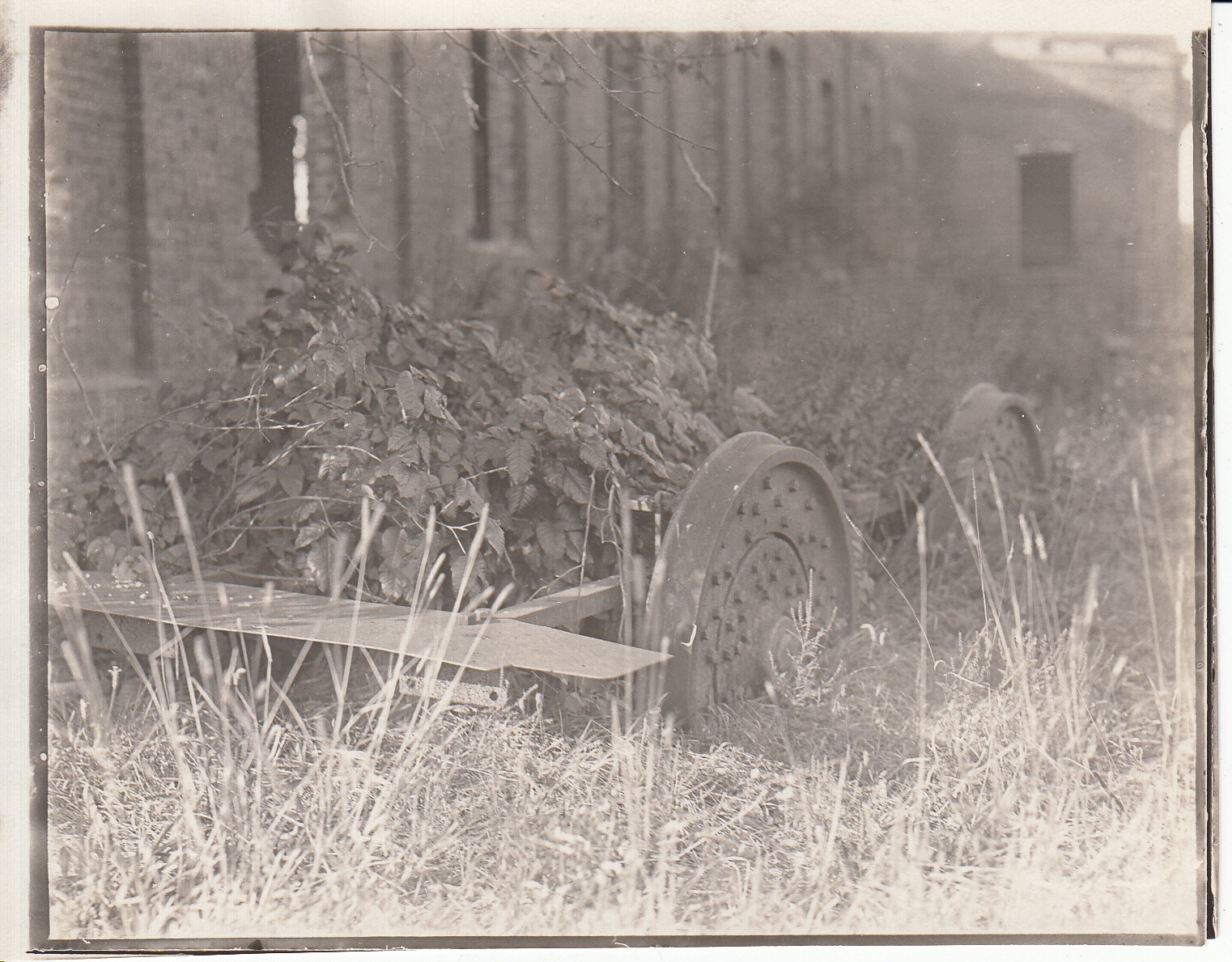 Ruins of electric locomotive outside machine shop at Menlo Park.