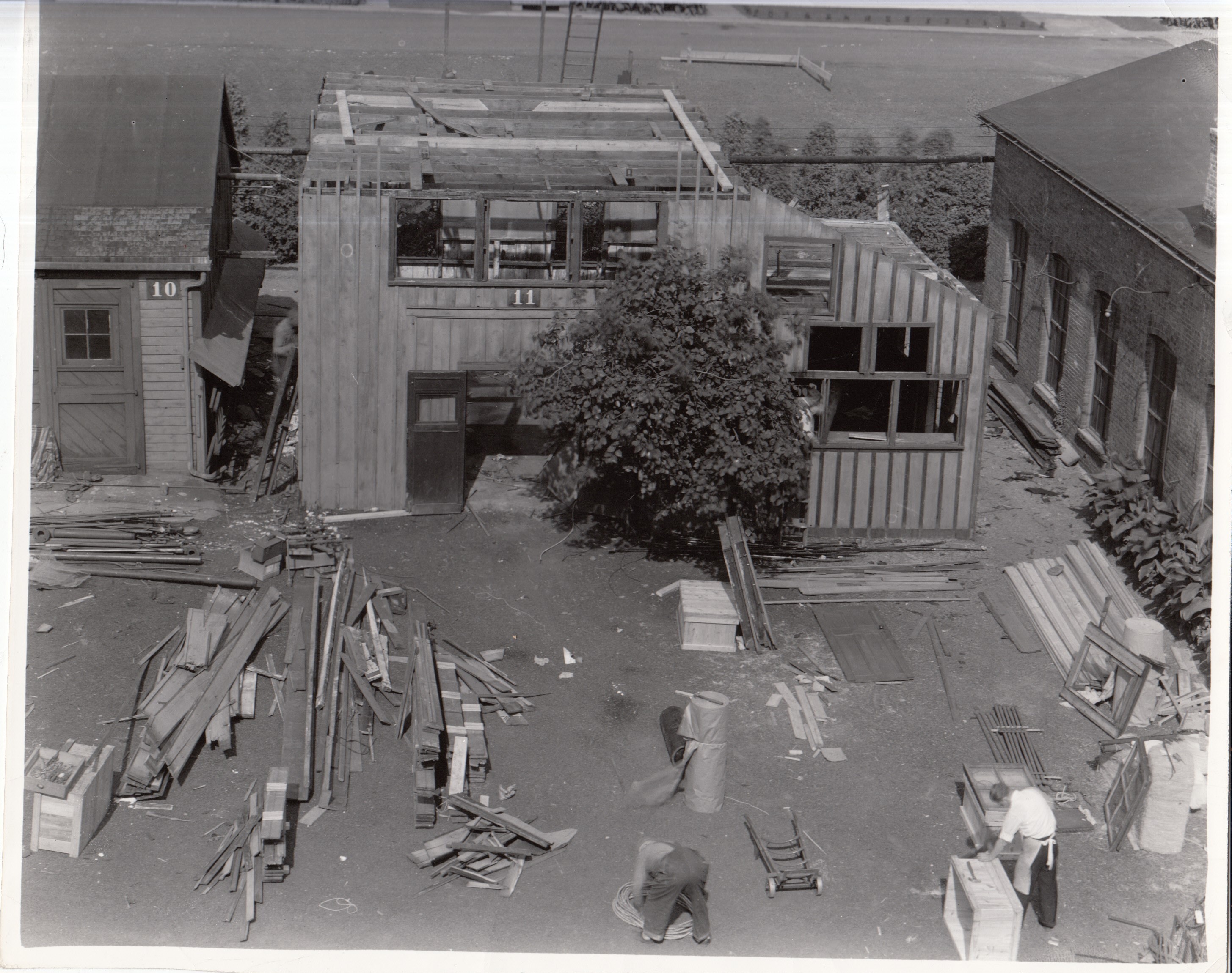 Laboratory Building 11 being disassembled for removal to Dearborn, Michigan.