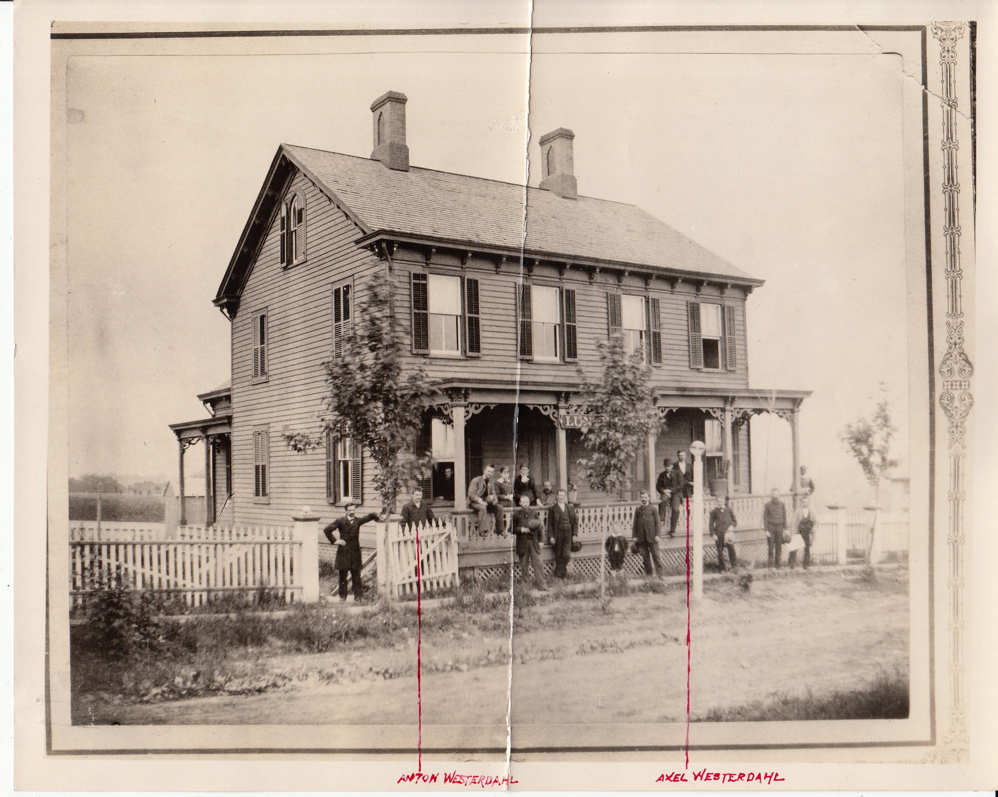 Mrs. Jordan's Boarding House with workers standing in front. Anton and Alex Westerdahl are marked in photo.