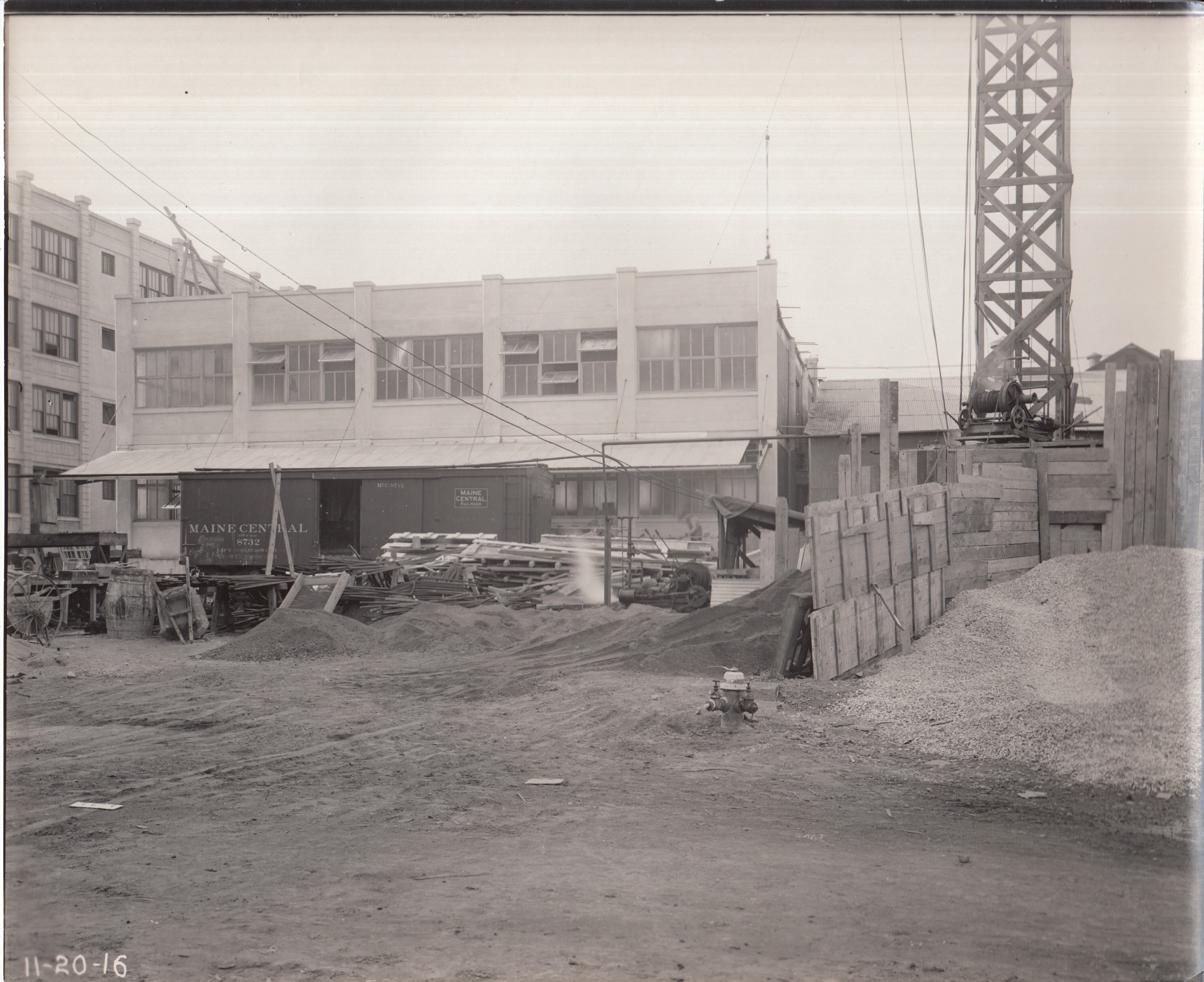 Construction of first half of Building 21, viewed from yard.