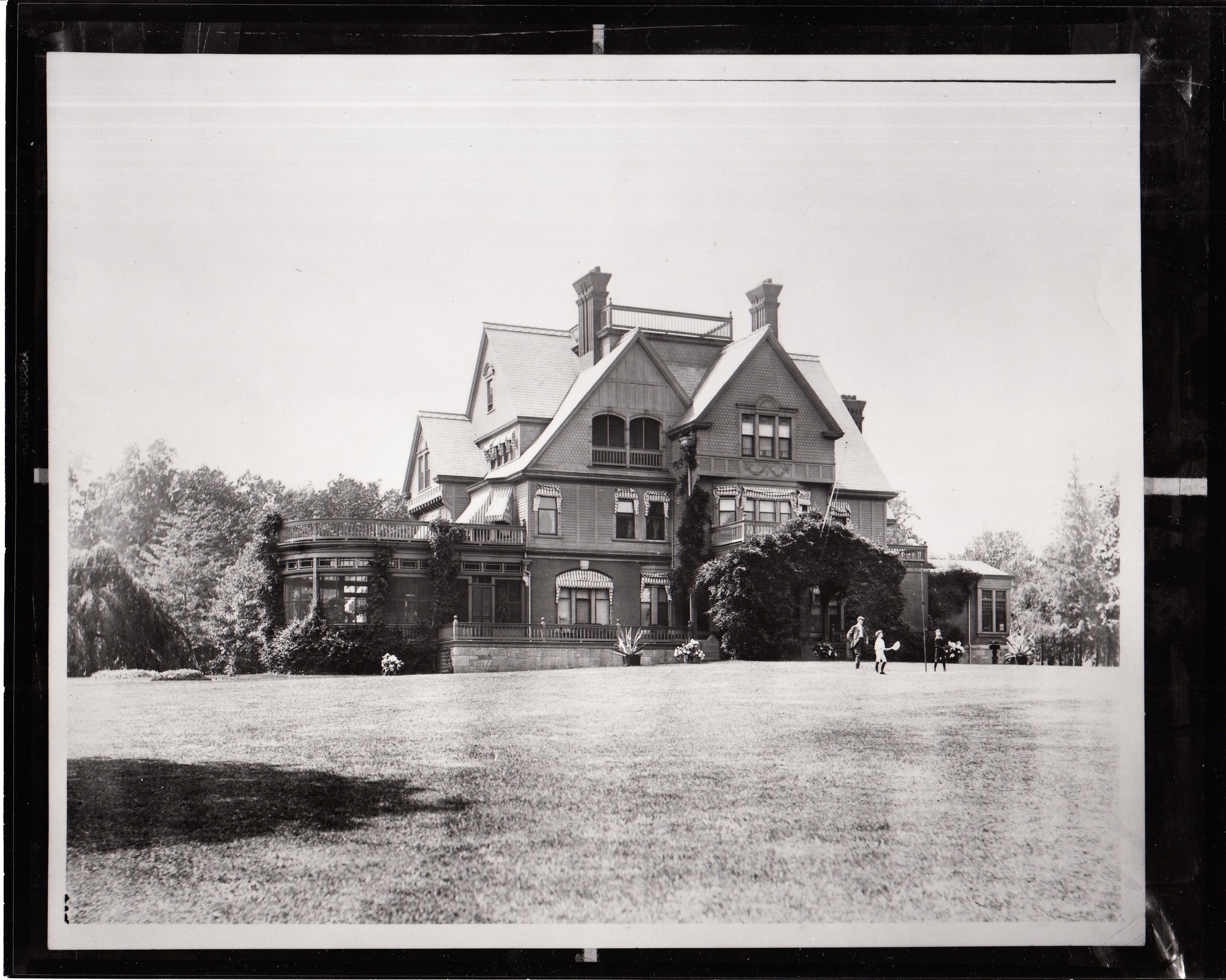 Glenmont, exterior, front, children playing on lawn.