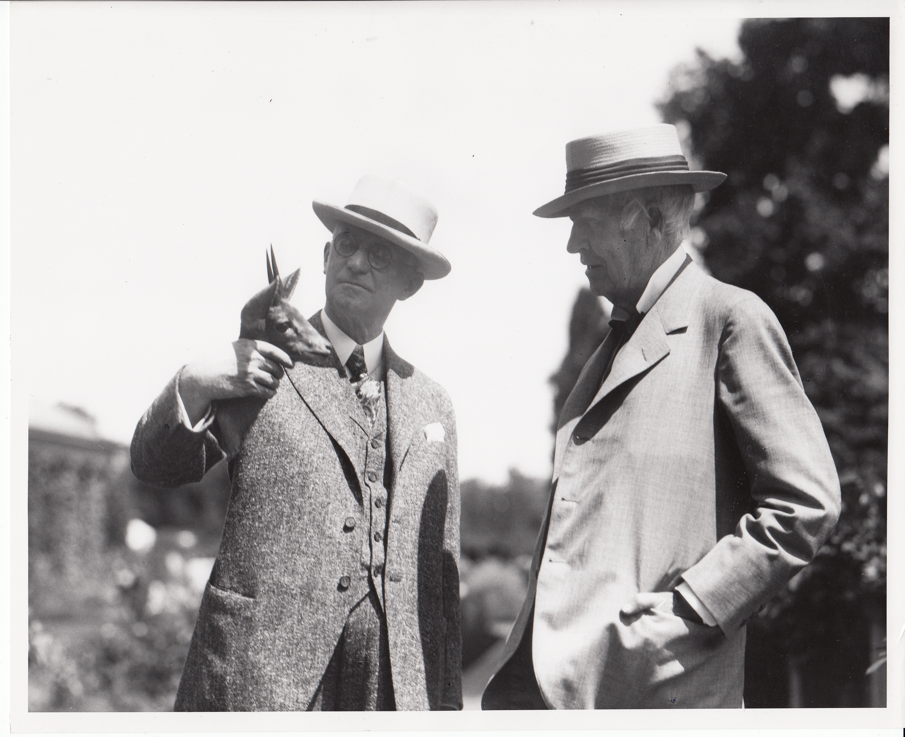 George Eastman showing the head of a Gazelle to Thomas Edison during the introduction of Kodacolor film at Eastman's home.