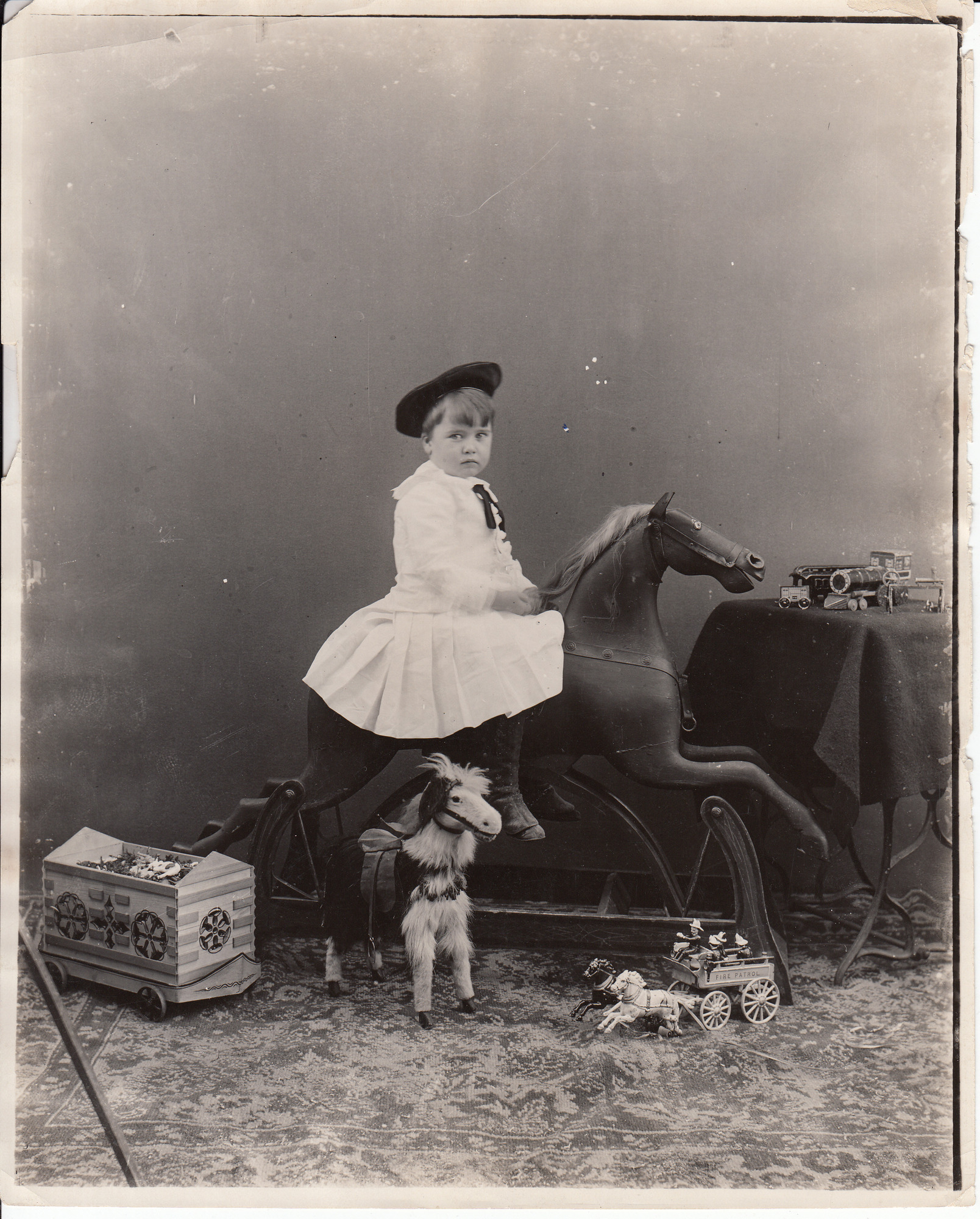 Charles Edison on a rocking horse.