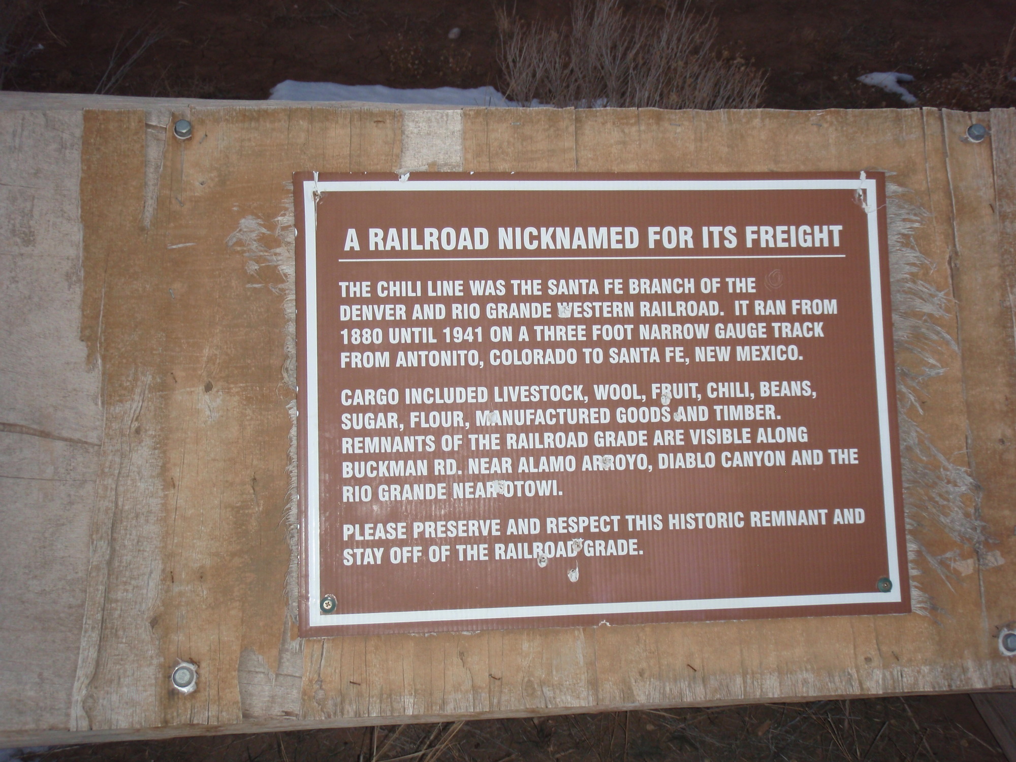 A sign with the text "A RAILROAD NICKNAMED FOR ITS FREIGHT" on it.