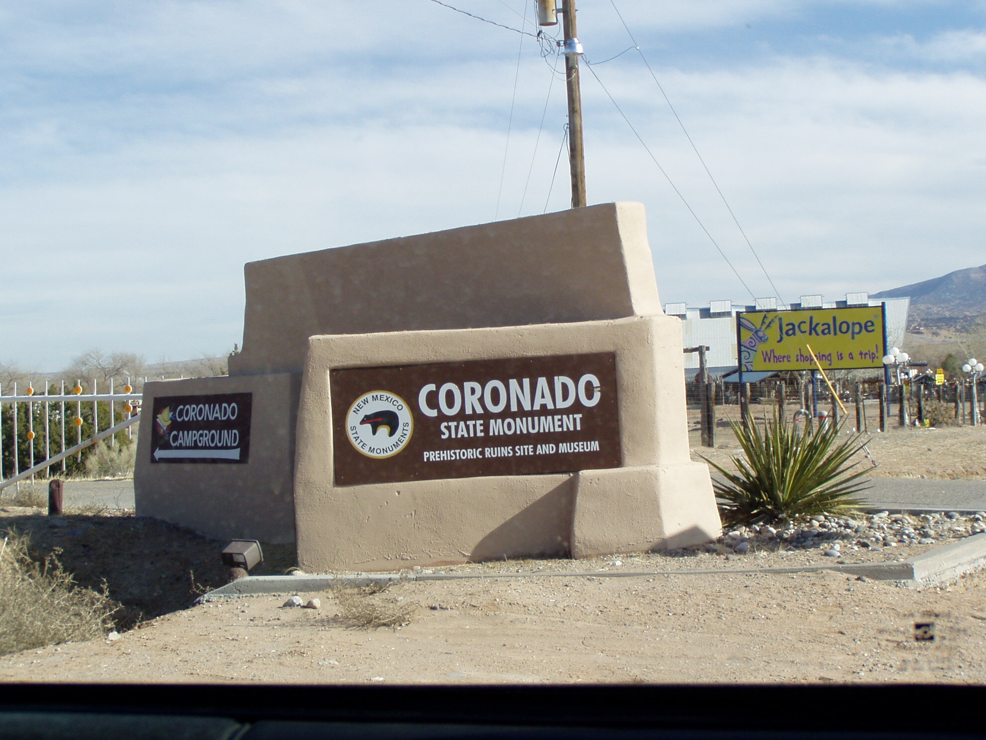 A sign with the text "coronado state monument" on it.