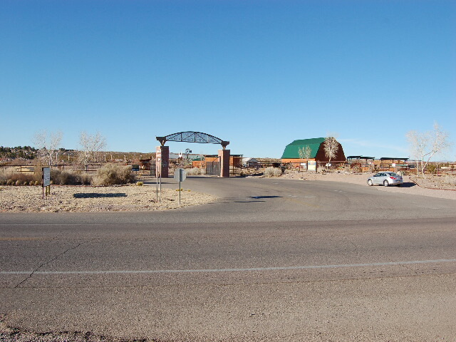 A car is driving down a deserted road.