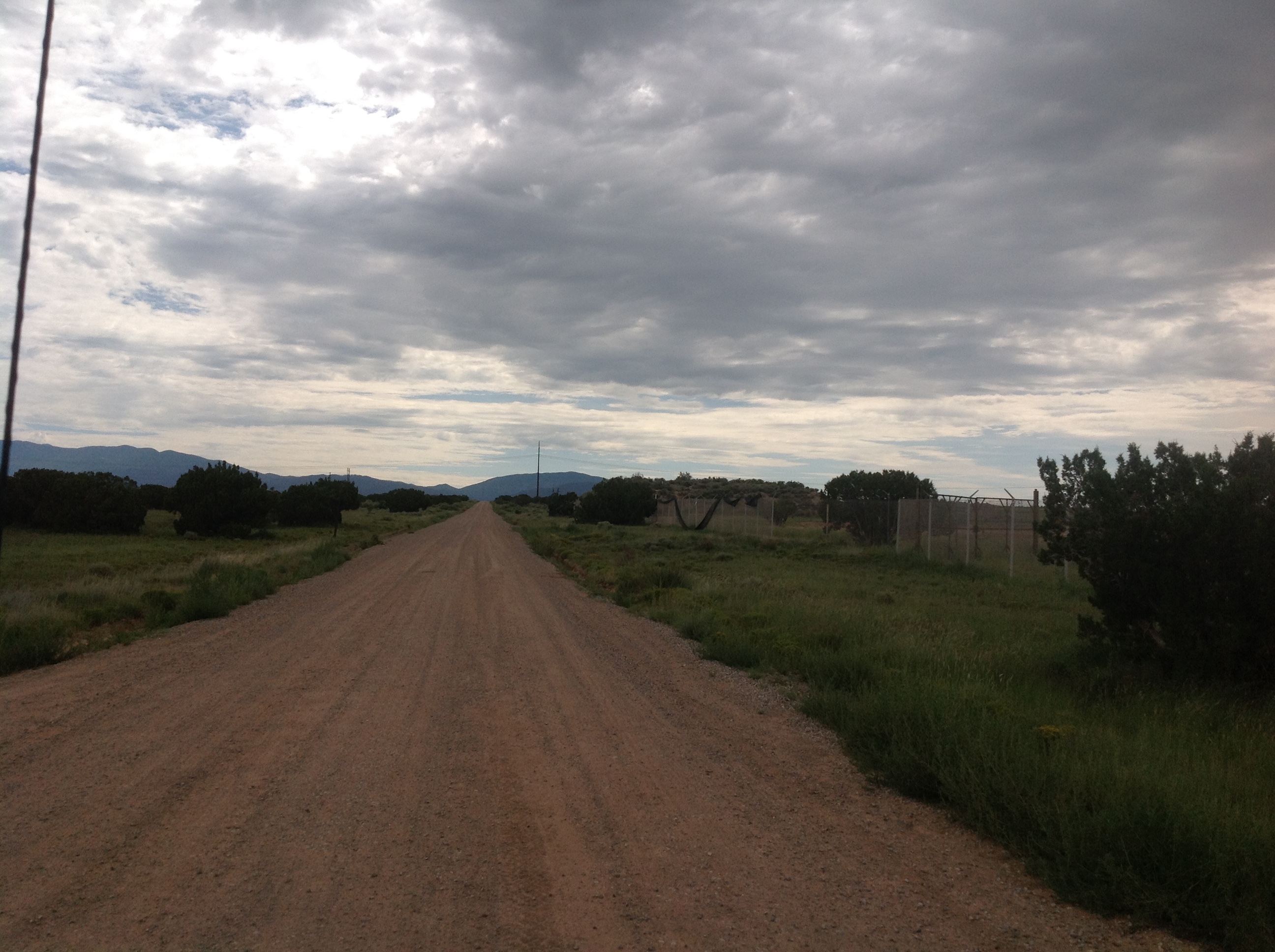 A dirt road in the middle of the desert.