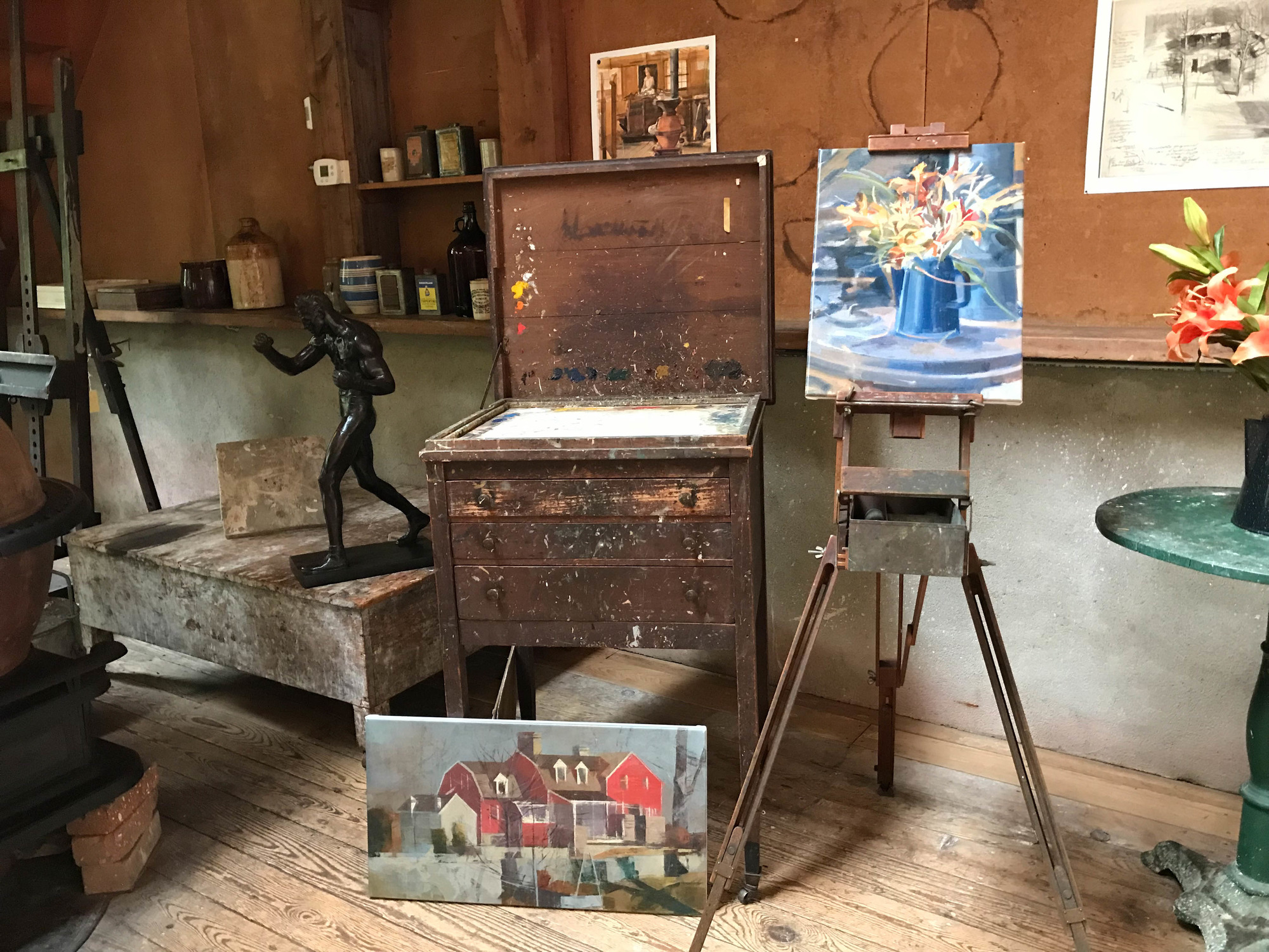Collection of art and art supplies inside an artist studio