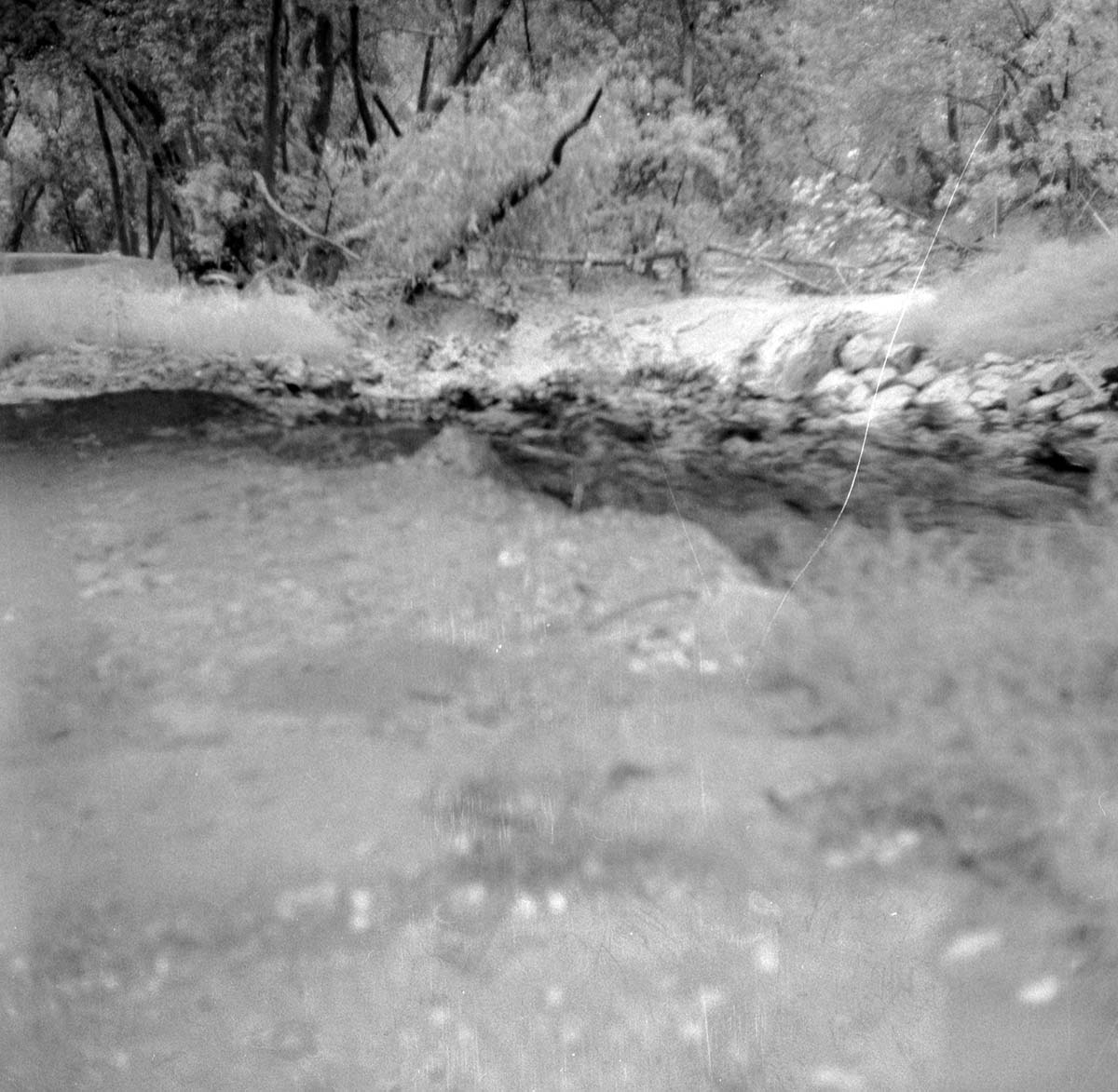 The flood damage from down pour - 1.38-inches in one hour high water in Oak Creek near bridge adjacent to Visitor Center employee's parking area (under State Route 9). Many large boulders were washed away.