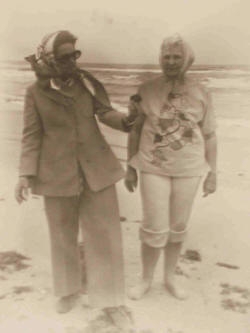 Ladybird Johnson (in sunglasses) walking the Padre Island beach while on the island for the park's dedication.