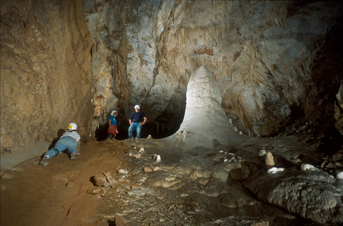 Caver crawls next to White Giant formation