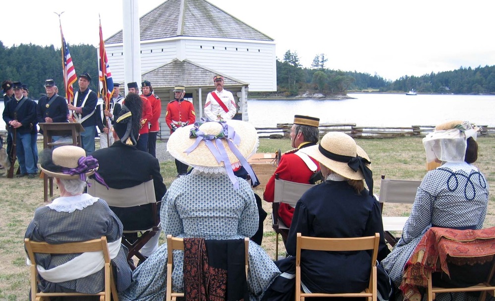 19th century hats and period dress lend a degree of authenticity to the re-dedication ceremony in front of the blockhouse.