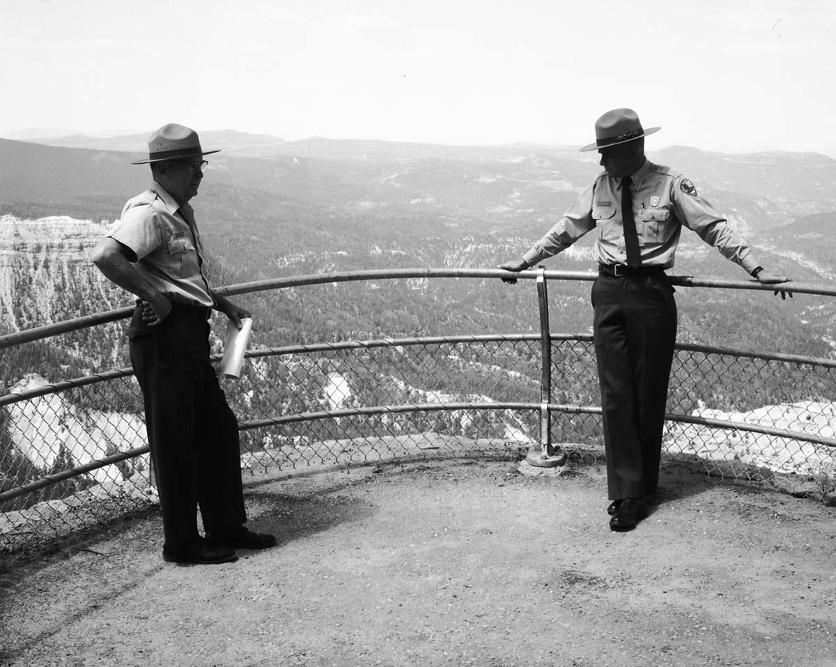 Carl E. Jepson and man standing at site selected for message repeater, Chessman Ridge Overlook and north view.