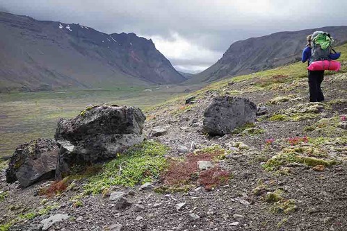 A hiker looking at the "gates" in Aniakchak crater.