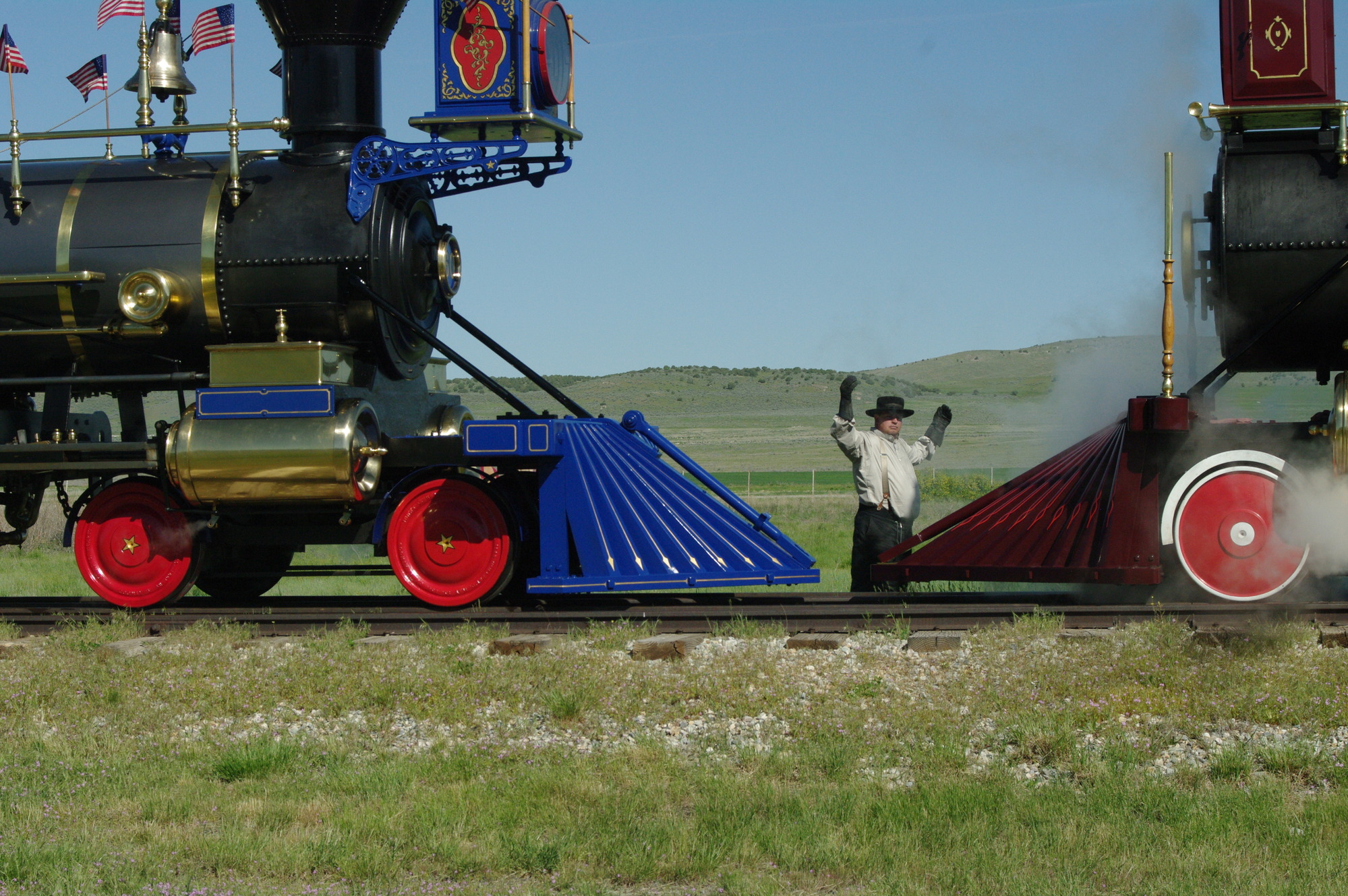 An engineer spots the locomotives as they stop within inches of one another. 