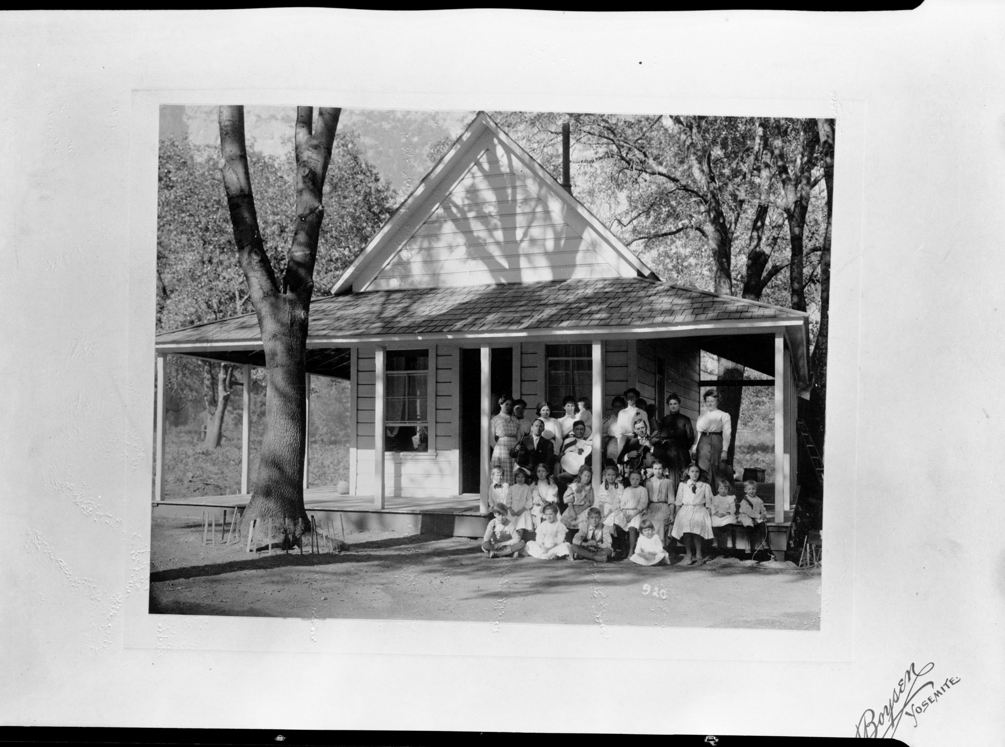 Old schoolhouse with a group of students. From John Dexter collection.