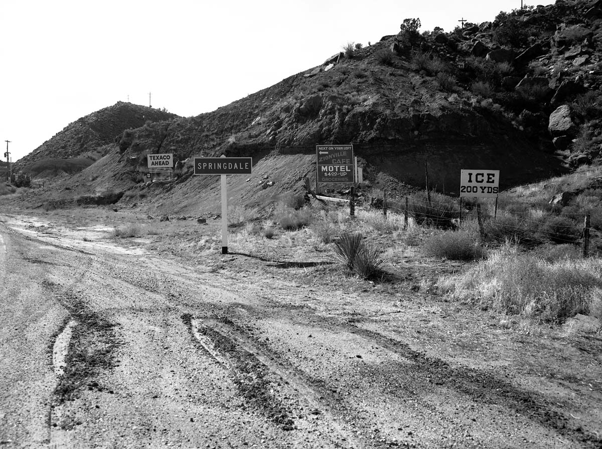 The roadside signs in Springdale signs just outside South Entrance on State Route 15 (State Route 9) approximately 200 yards south of park. For documentation for the proposed clean up project to remove undesirable signs and debris on the access route to Zion National Park.